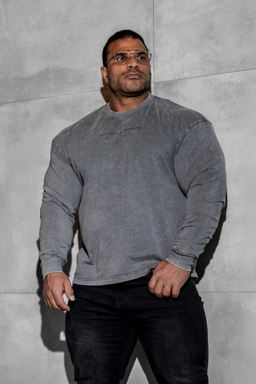 Vintage wash long sleeve t-shirt in storm gray with faded distressed texture and subtle chest embroidery