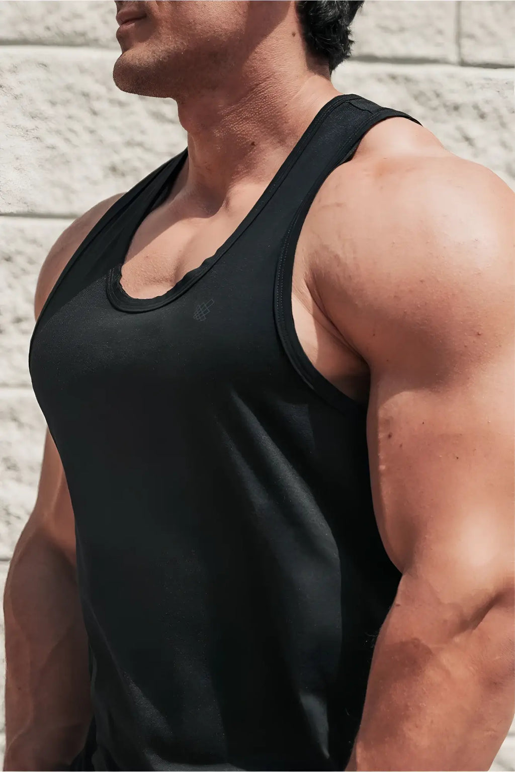 Black sleeveless Vital Raw-Hem Tank Top 2.0 with scoop neckline and ribbed trim in a soft, breathable fabric