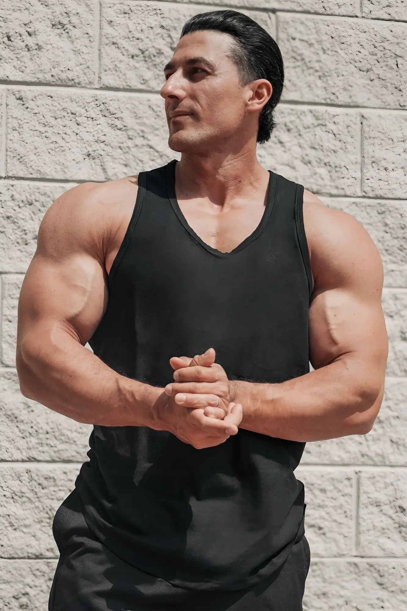 Black sleeveless vital raw-hem tank top 2.0 with v-neckline made of lightweight breathable fabric