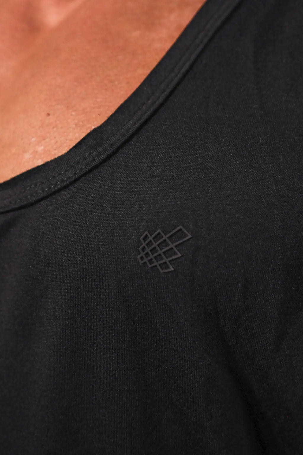 Black vital raw-hem tank top 2.0 with subtle geometric logo embroidered near the neckline