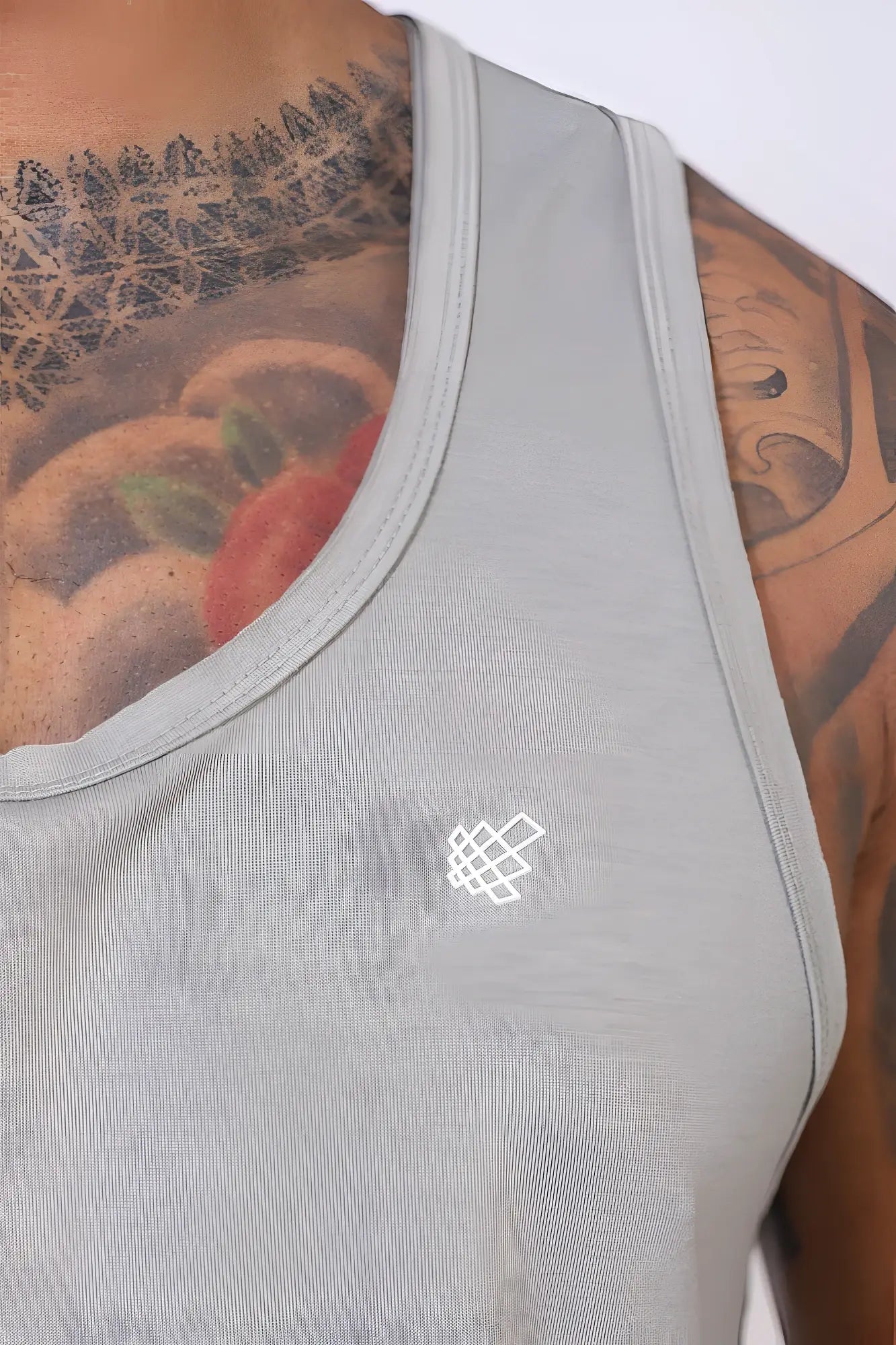 Jed North Vital raw-hem gray athletic tank top with a small white geometric logo on the chest for workouts