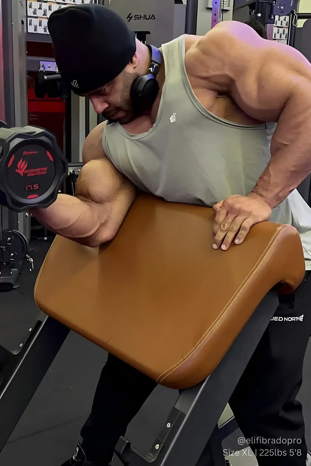 Brown leather incline bench shown with jed north vital raw-hem tank top 2.0 in gray displayed on it