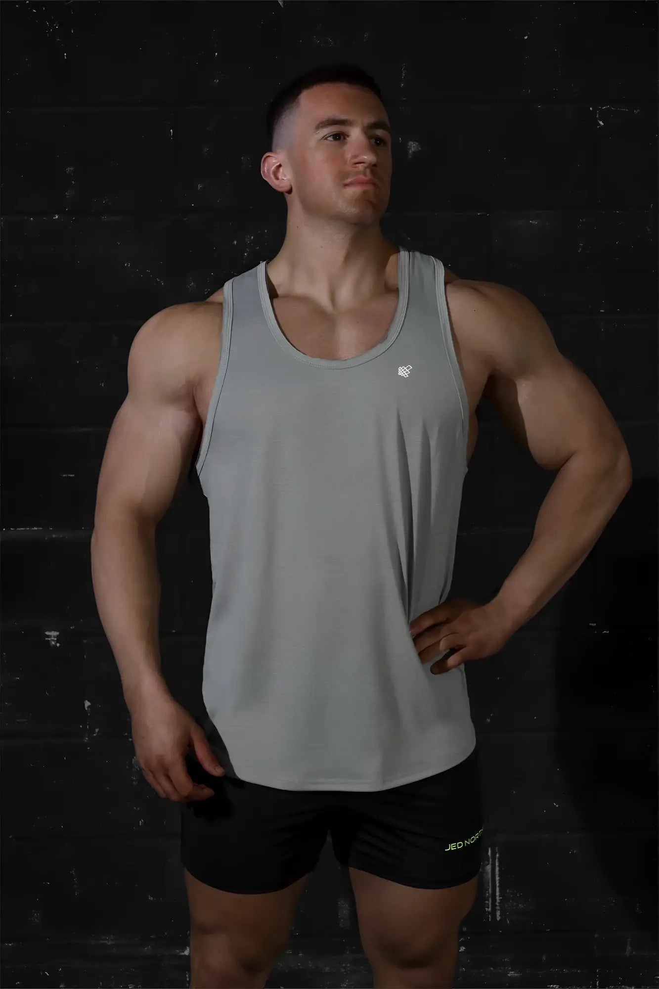 Jed North Vital Raw-Hem Tank Top 2.0 gray sleeveless athletic top with subtle chest logo and raw-hem detail