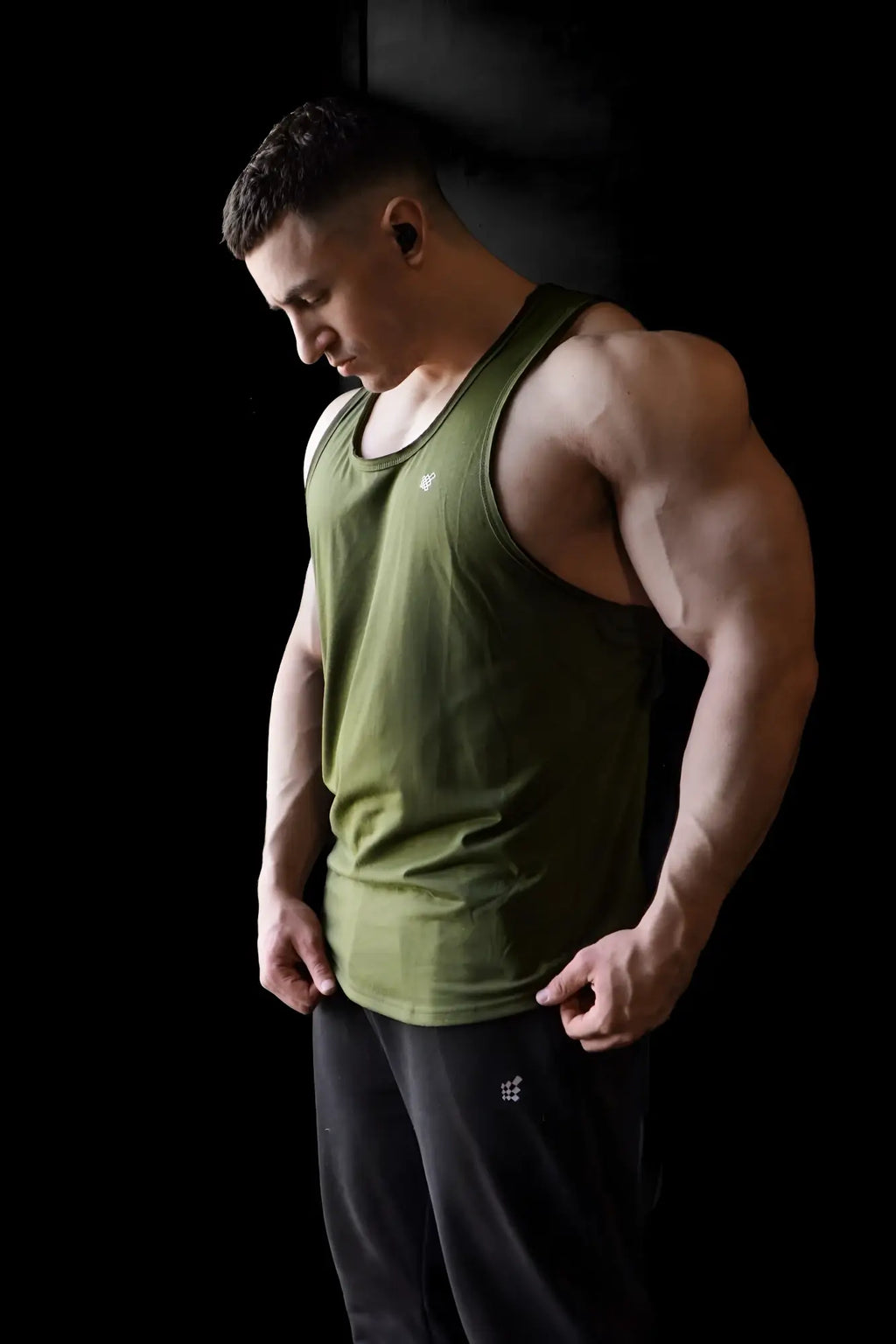 Olive green sleeveless athletic tank top with raw hem by jed north designed for activewear and comfort