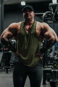 Olive green sleeveless jed north vital raw-hem tank top 2.0 with v-neck and subtle chest logo for athletic use