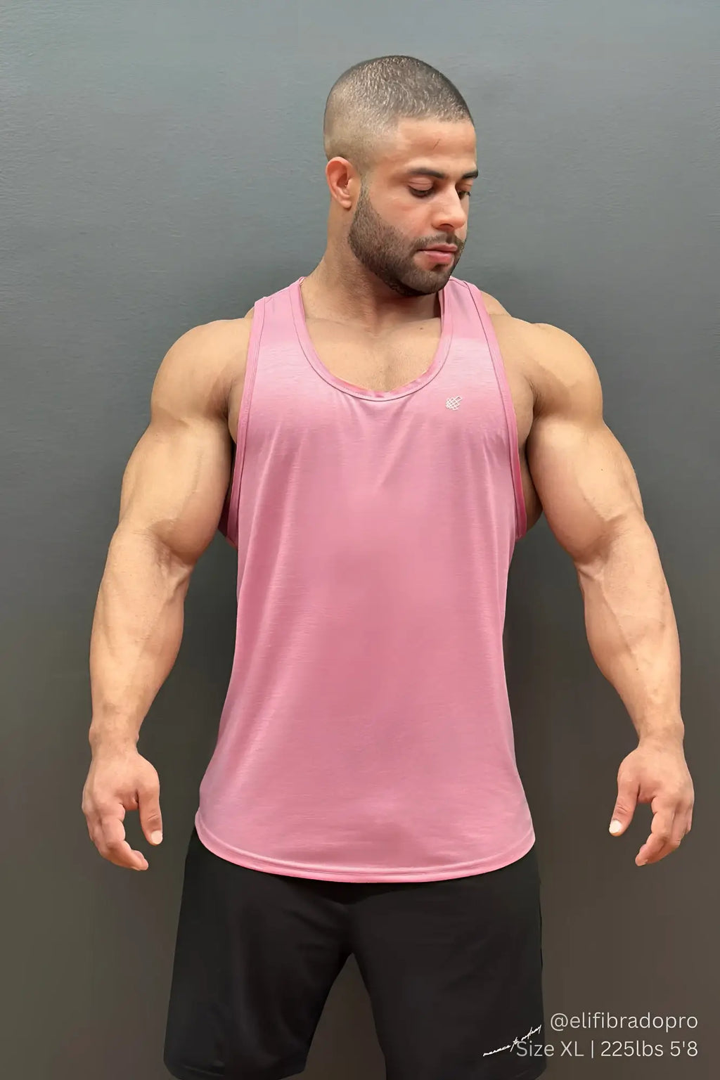 Jed North Vital raw-hem tank top 2.0 in salmon pink features a subtle logo on the chest for athletic wear