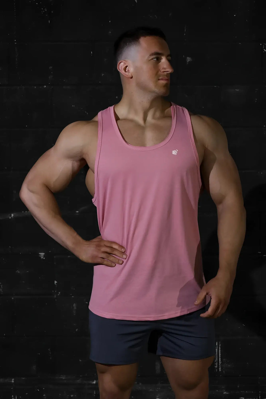 Pink sleeveless Jed North Vital Raw-Hem Tank Top 2.0 with subtle white logo on chest for athletic wear