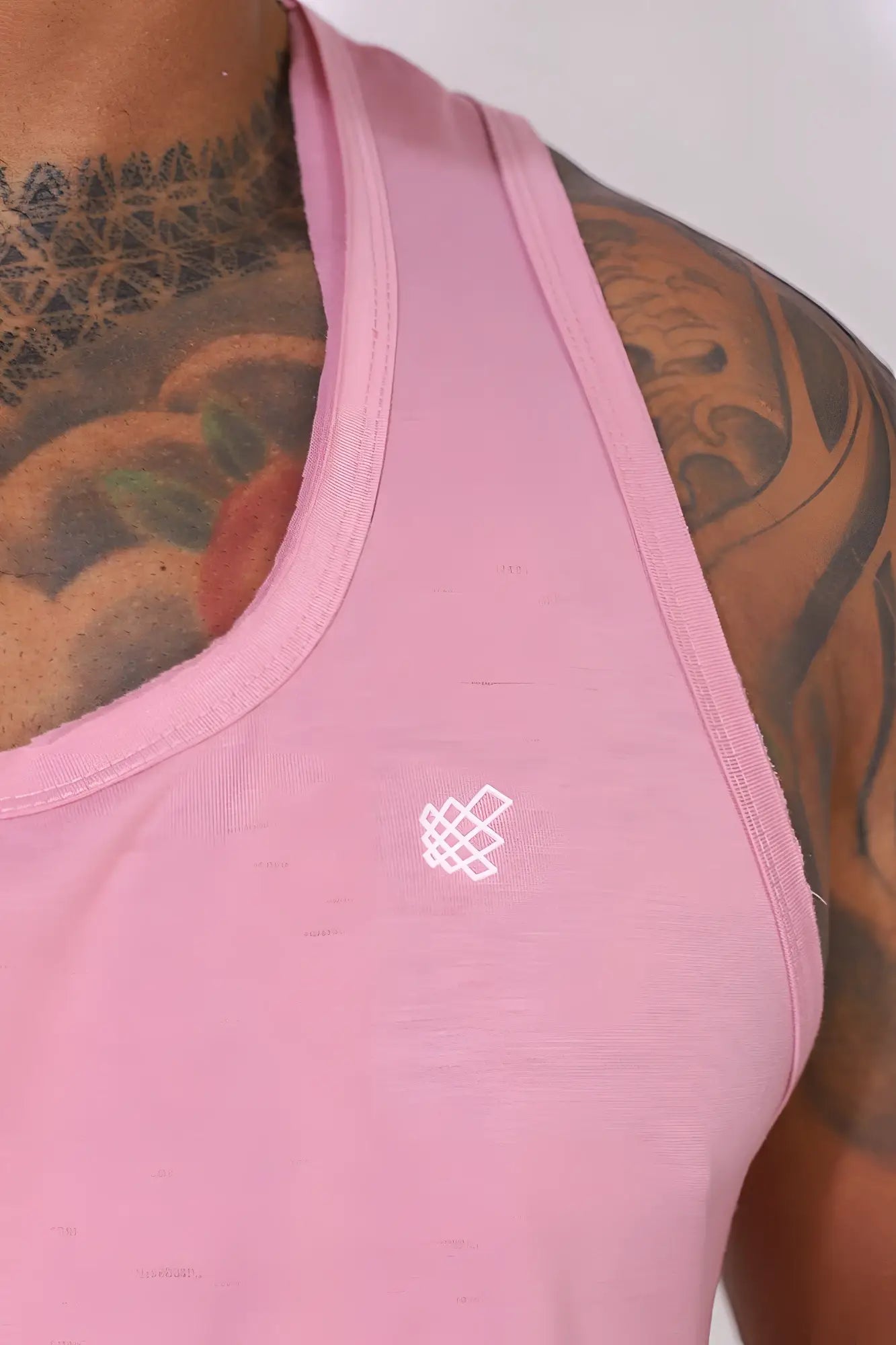 Jed north vital raw-hem tank top 2.0 salmon pink soft sleeveless with subtle white geometric logo on chest