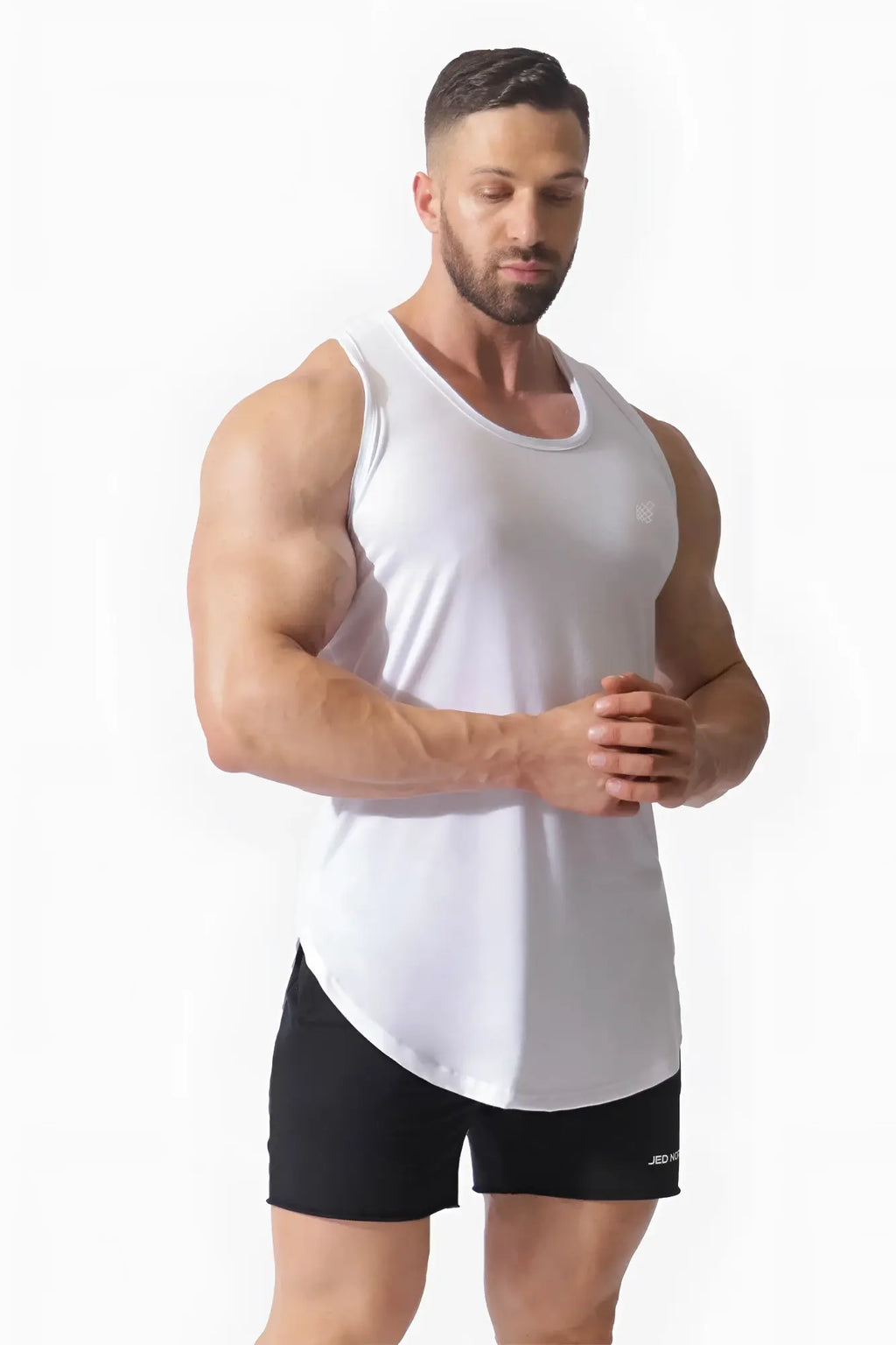 White sleeveless vital raw-hem tank top 2.0 with rounded neckline and curved hemline for athletic wear