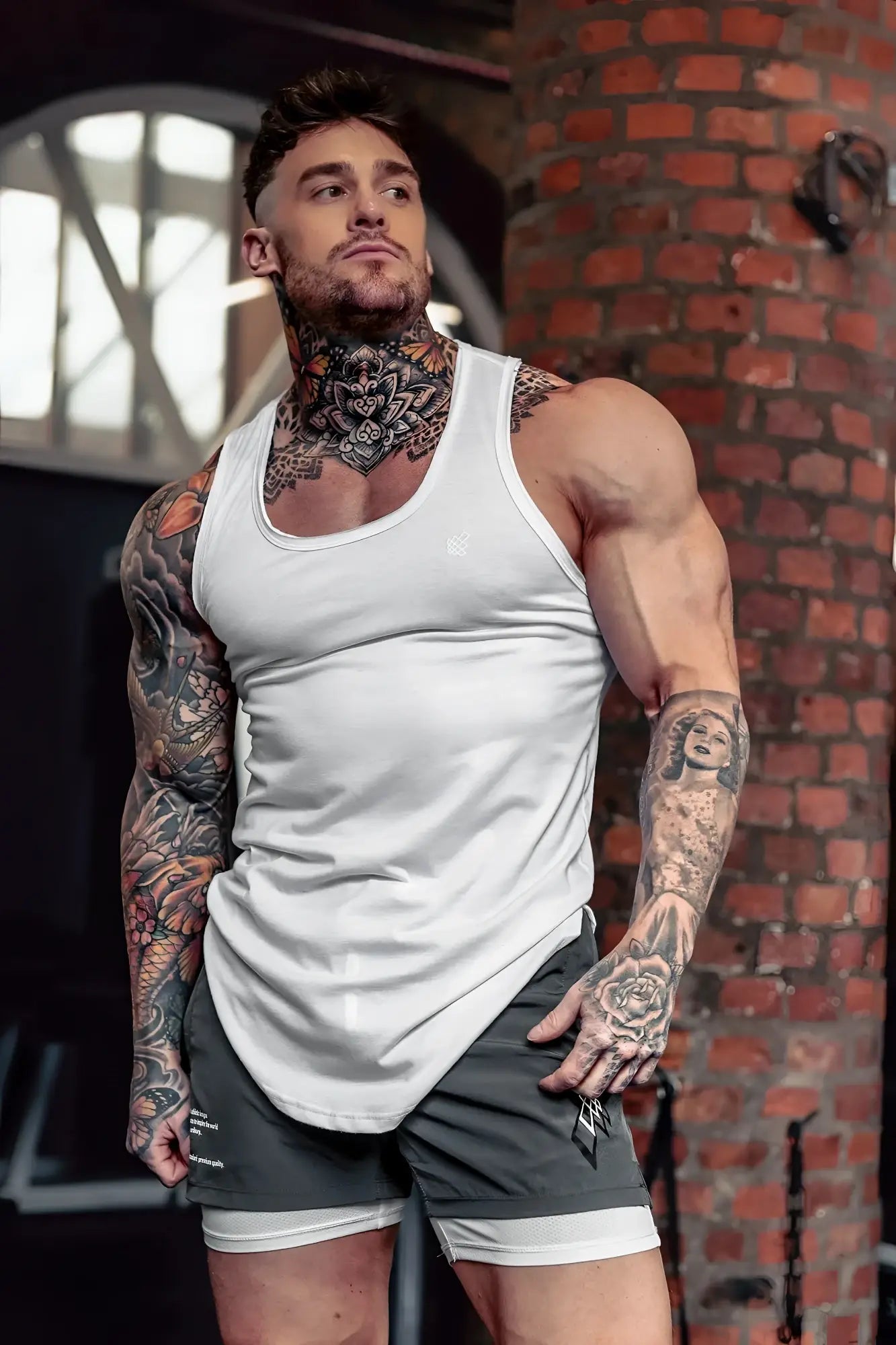 White sleeveless Vital Raw-Hem Tank Top 2.0 with fitted athletic cut and subtle side seam detailing