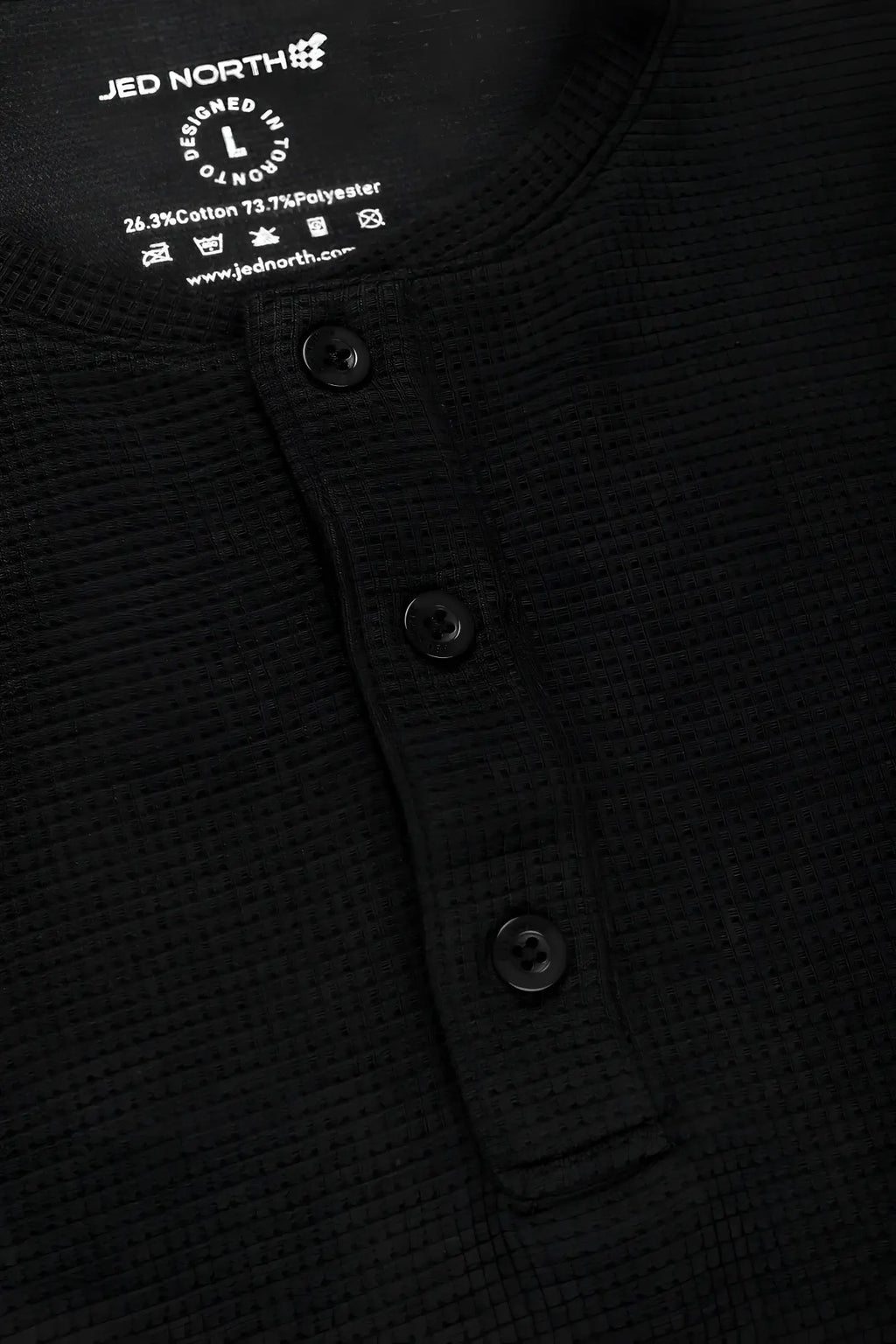 Black waffle henley t-shirt with three buttons and jed north label made from waffle-knit fabric