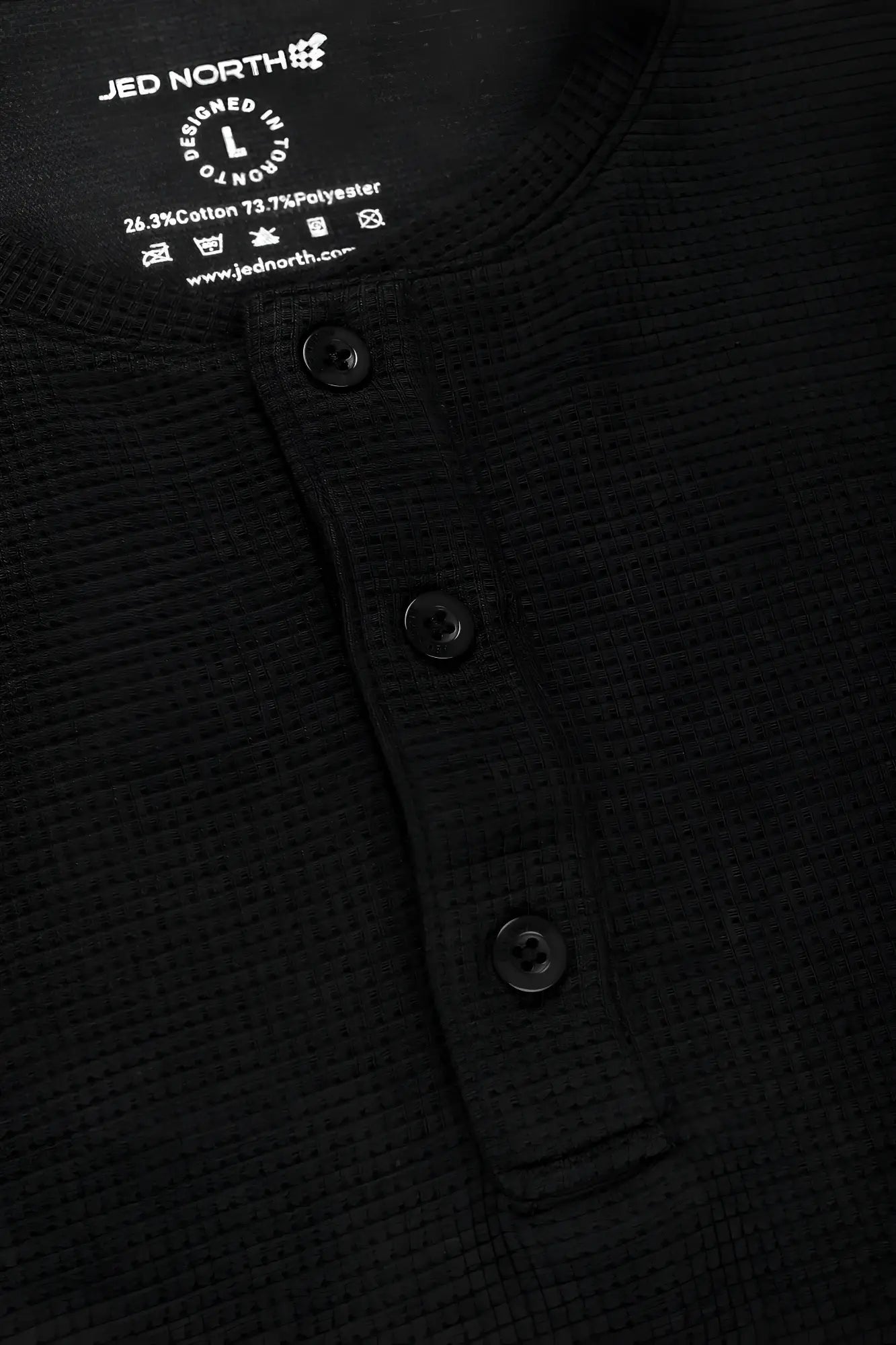 Black waffle henley t-shirt with three buttons and jed north label made from waffle-knit fabric