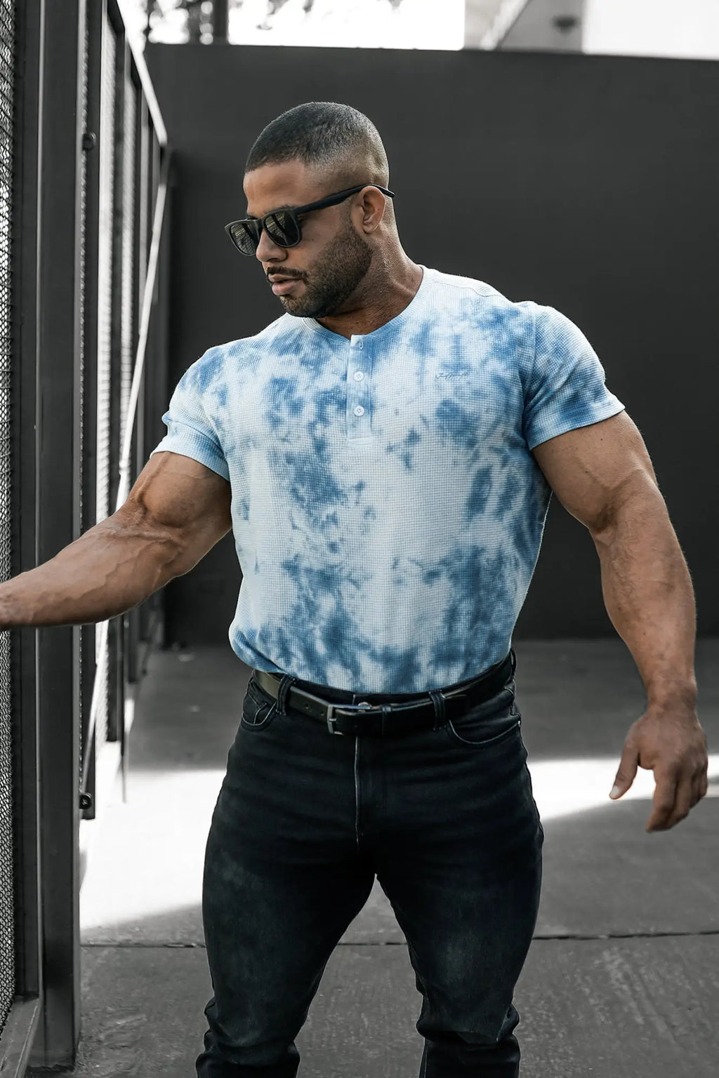 Blue and white tie dye waffle henley t-shirt with short sleeves made from textured fabric for casual wear