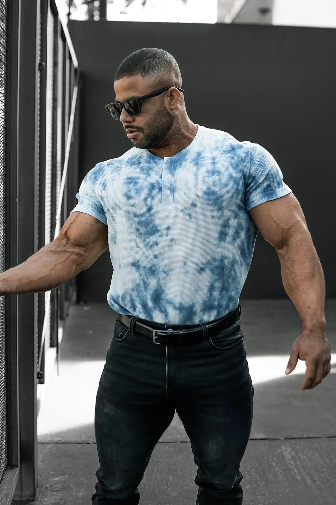 Blue and white tie dye waffle henley t-shirt with short sleeves made from textured fabric for casual wear
