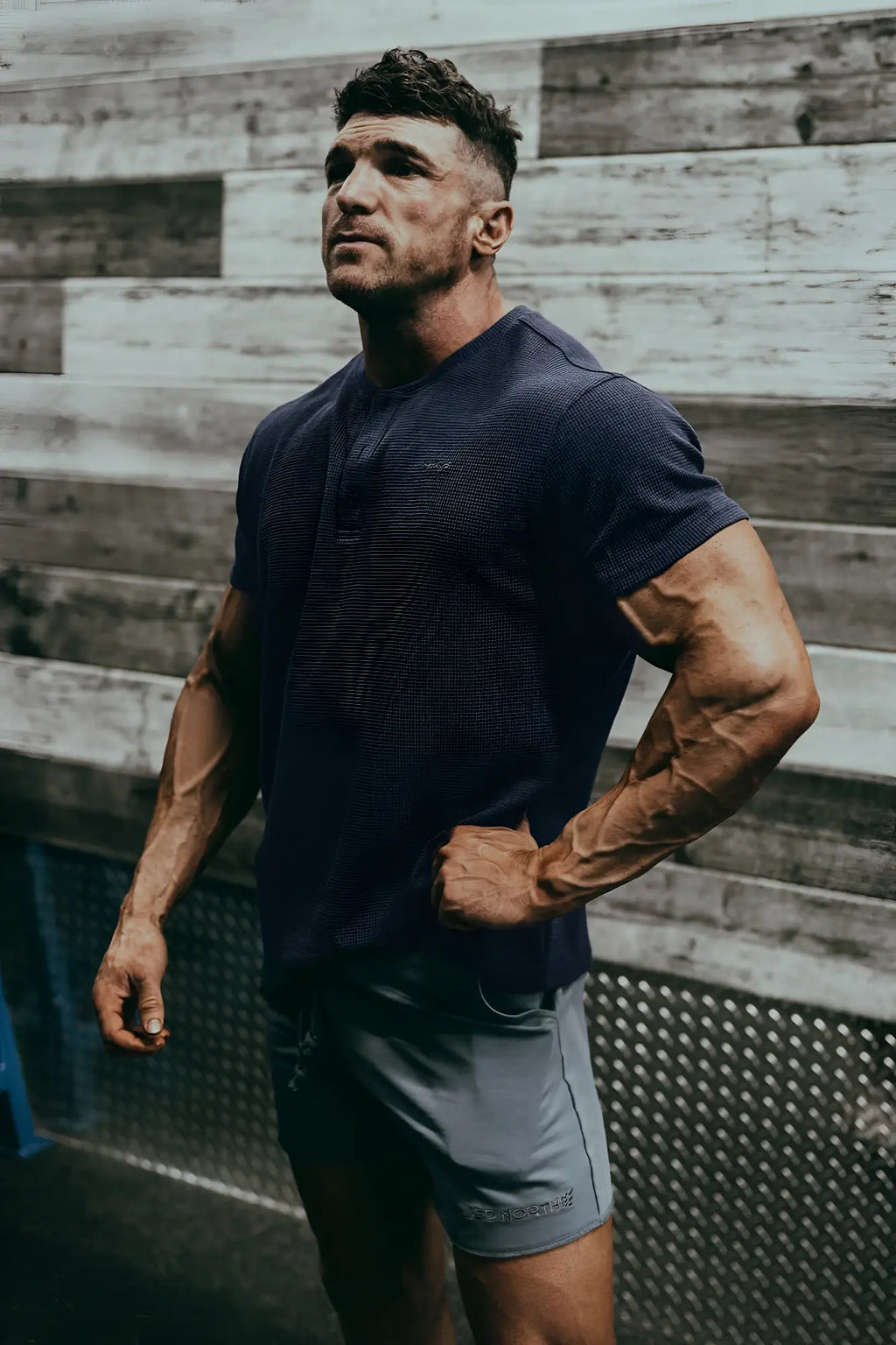 Dark navy blue textured short-sleeved henley shirt featuring waffle knit fabric for casual wear