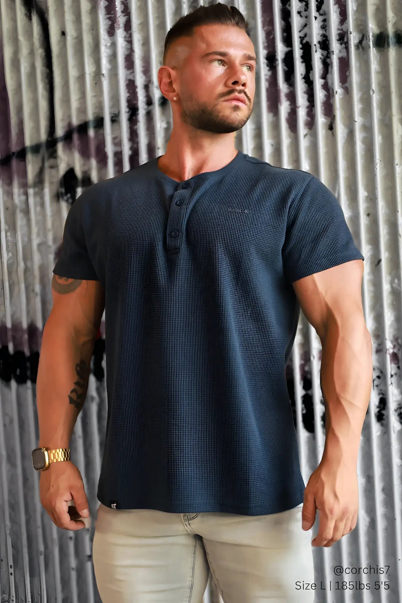 Dark blue textured waffle henley t-shirt with short sleeves and button placket in dusty blue color