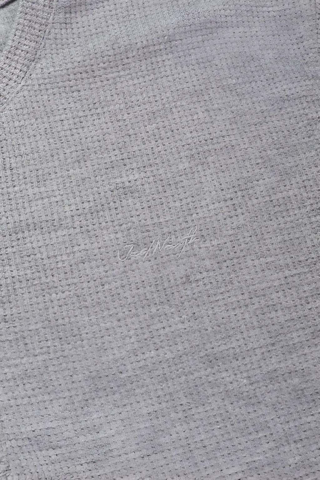 Gray waffle henley t shirt with waffle knit texture and subtle embroidered logo in light gray color