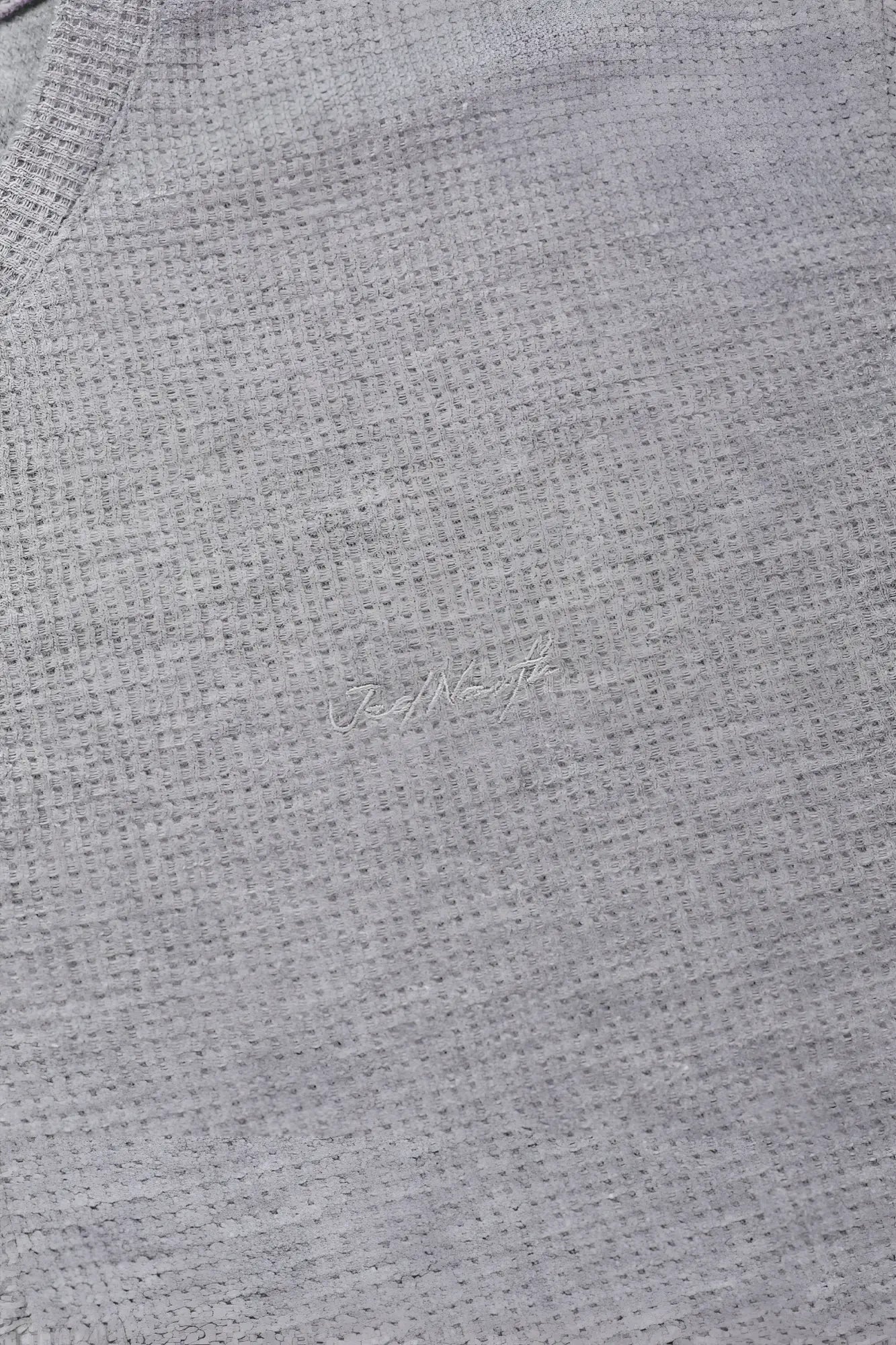 Gray waffle henley t shirt with waffle knit texture and subtle embroidered logo in light gray color