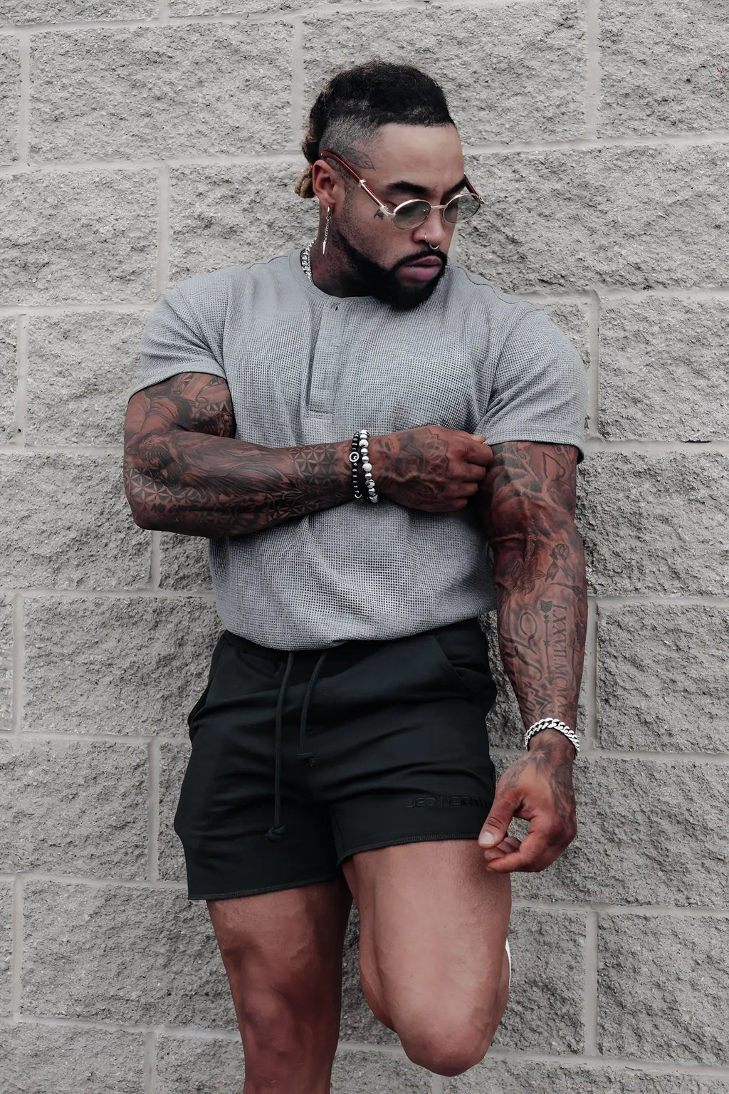 Light gray waffle henley t-shirt with textured short sleeves made from breathable material for casual wear