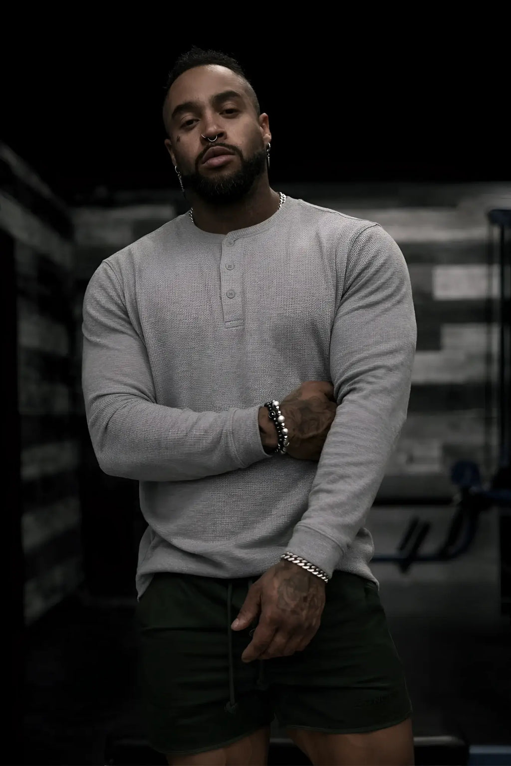 Gray waffle knit henley long sleeve t-shirt showing textured fabric and buttoned collar detail