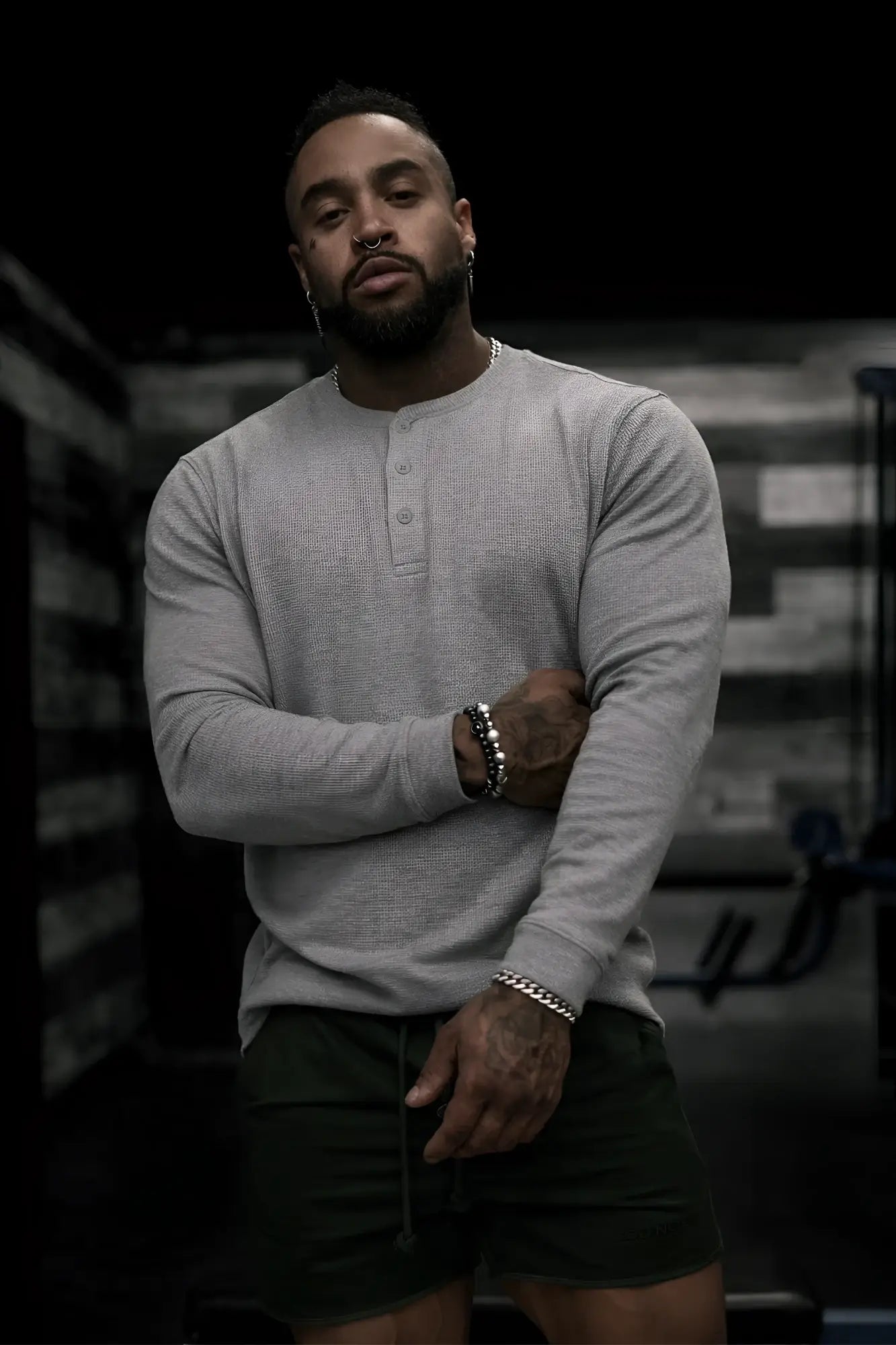 Gray waffle knit henley long sleeve t-shirt showing textured fabric and buttoned collar detail