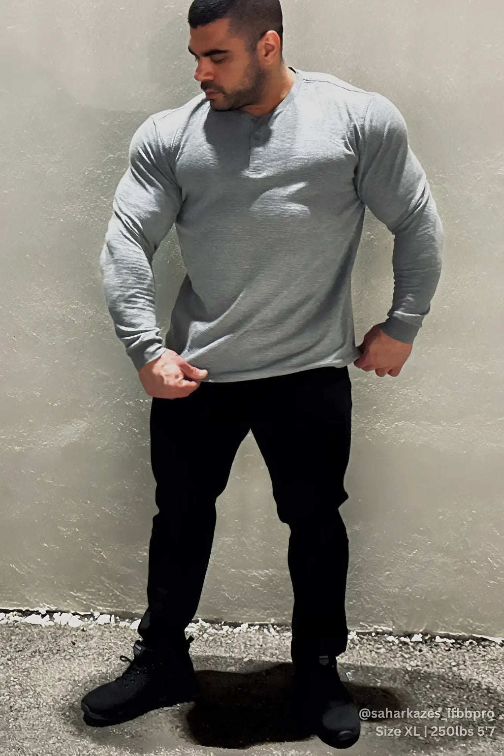 Dark gray waffle knit henley long sleeve t shirt made of soft breathable fabric with button placket
