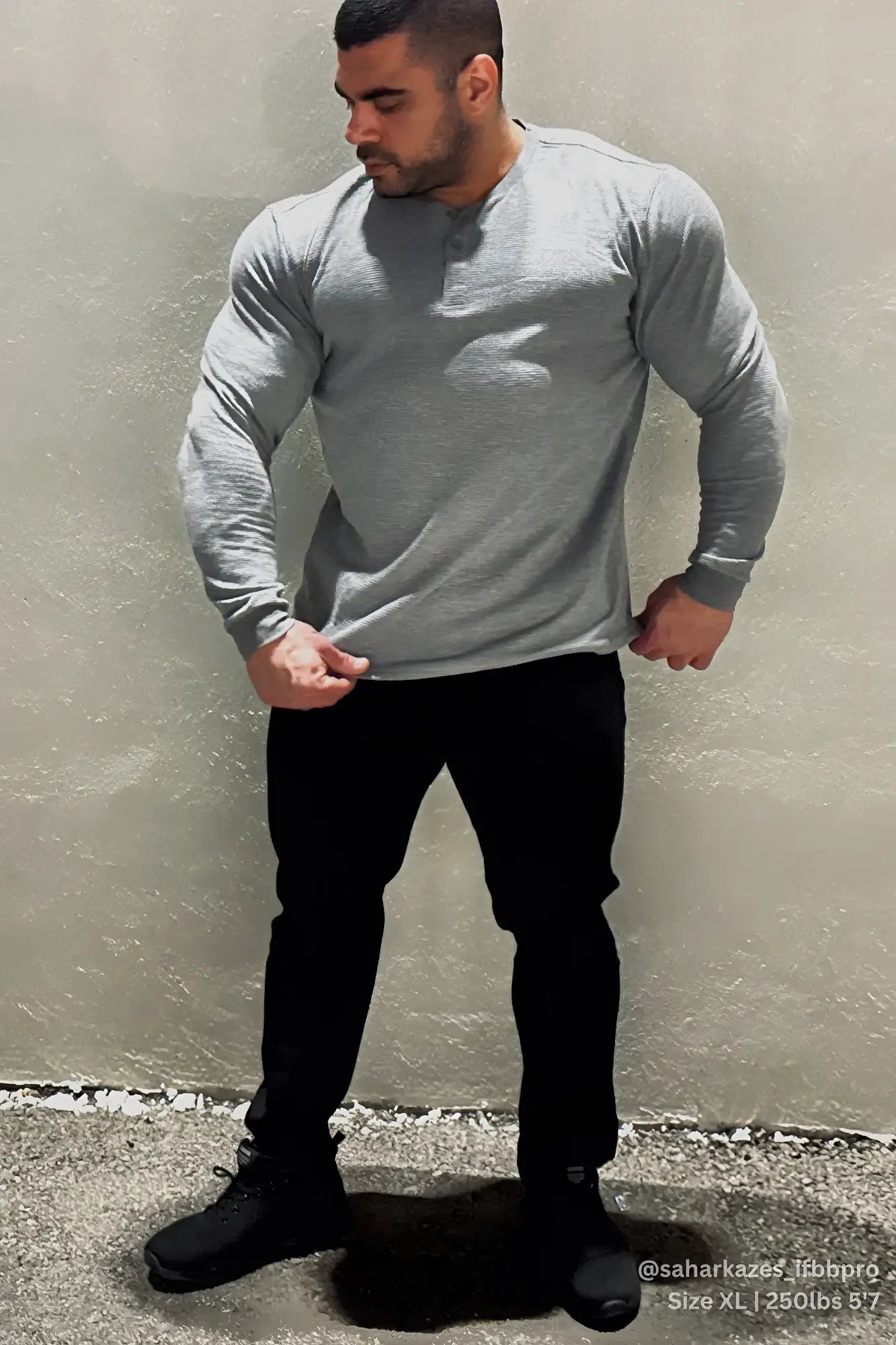 Dark gray waffle knit henley long sleeve t shirt made of soft breathable fabric with button placket