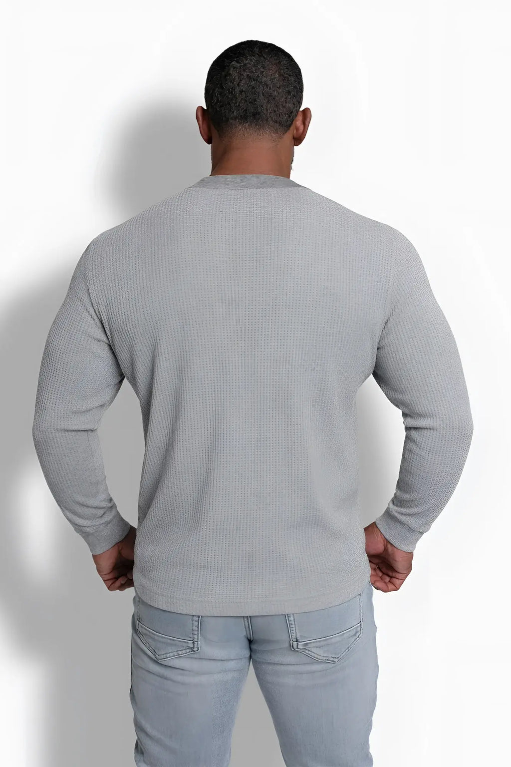 Gray waffle knit henley long sleeve t shirt made of textured fabric ideal for casual wear