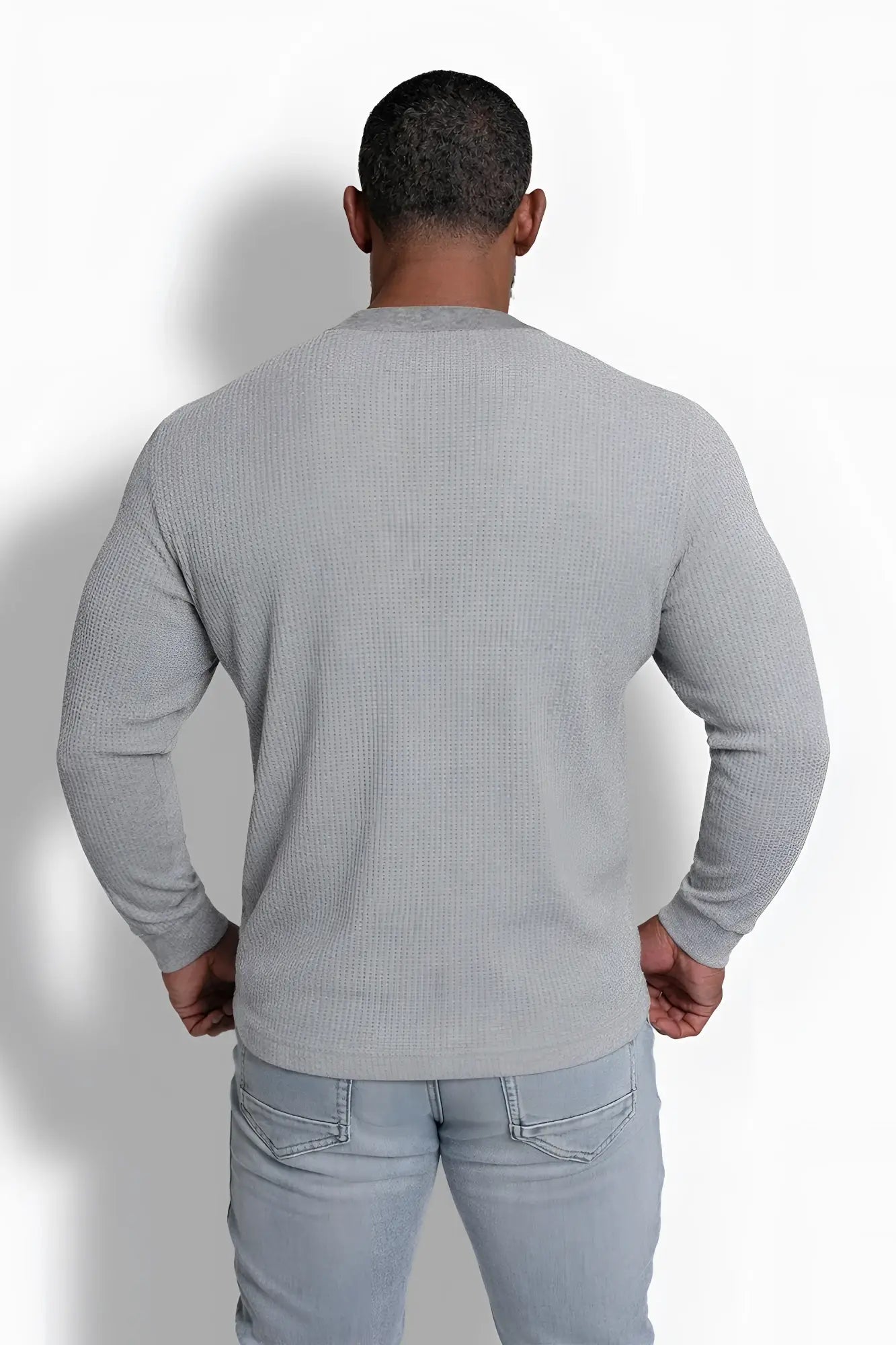 Gray waffle knit henley long sleeve t shirt made of textured fabric ideal for casual wear