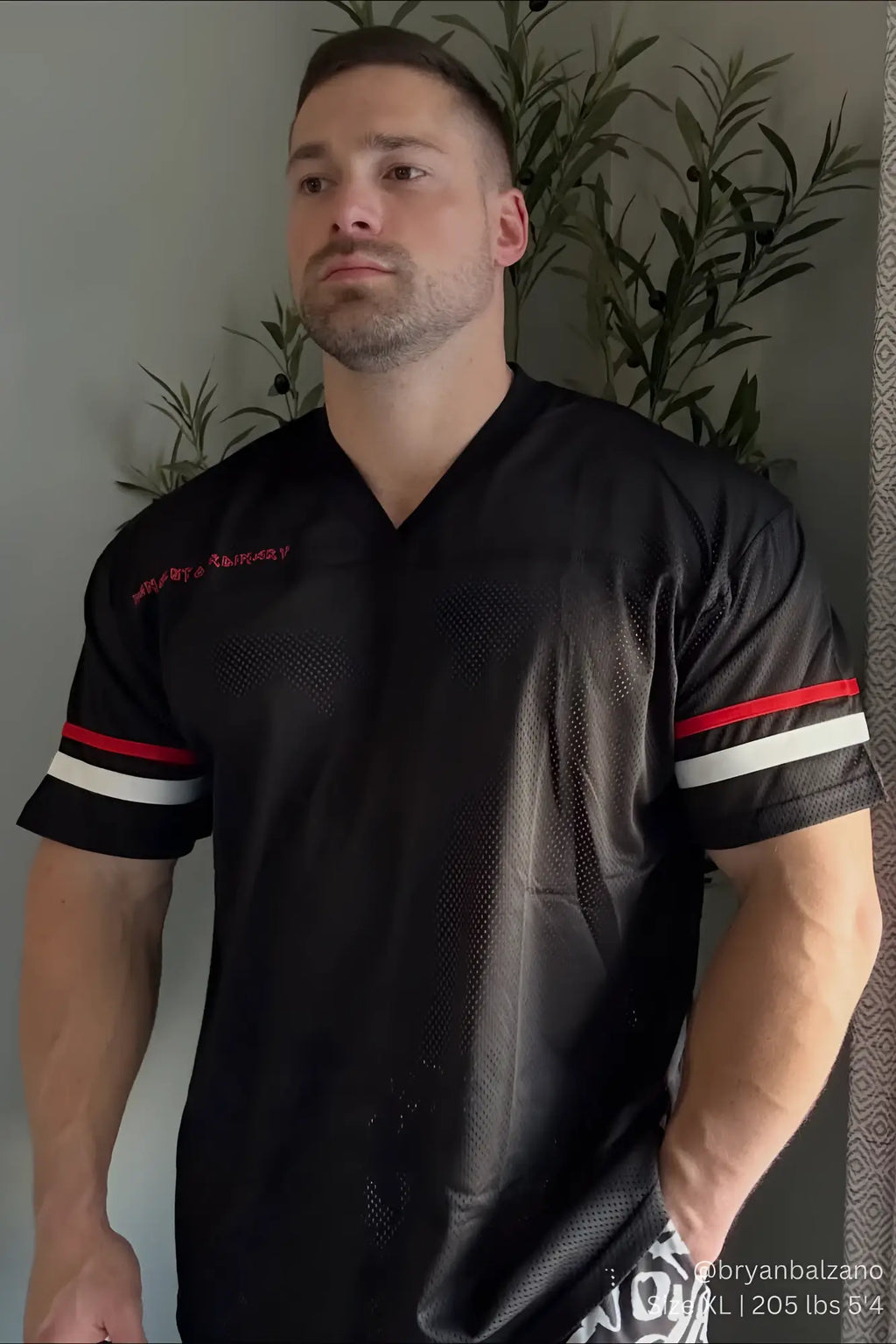 Jed North Warrior V-Neck jersey black with red and white striped sleeves mesh fabric and embroidered chest text