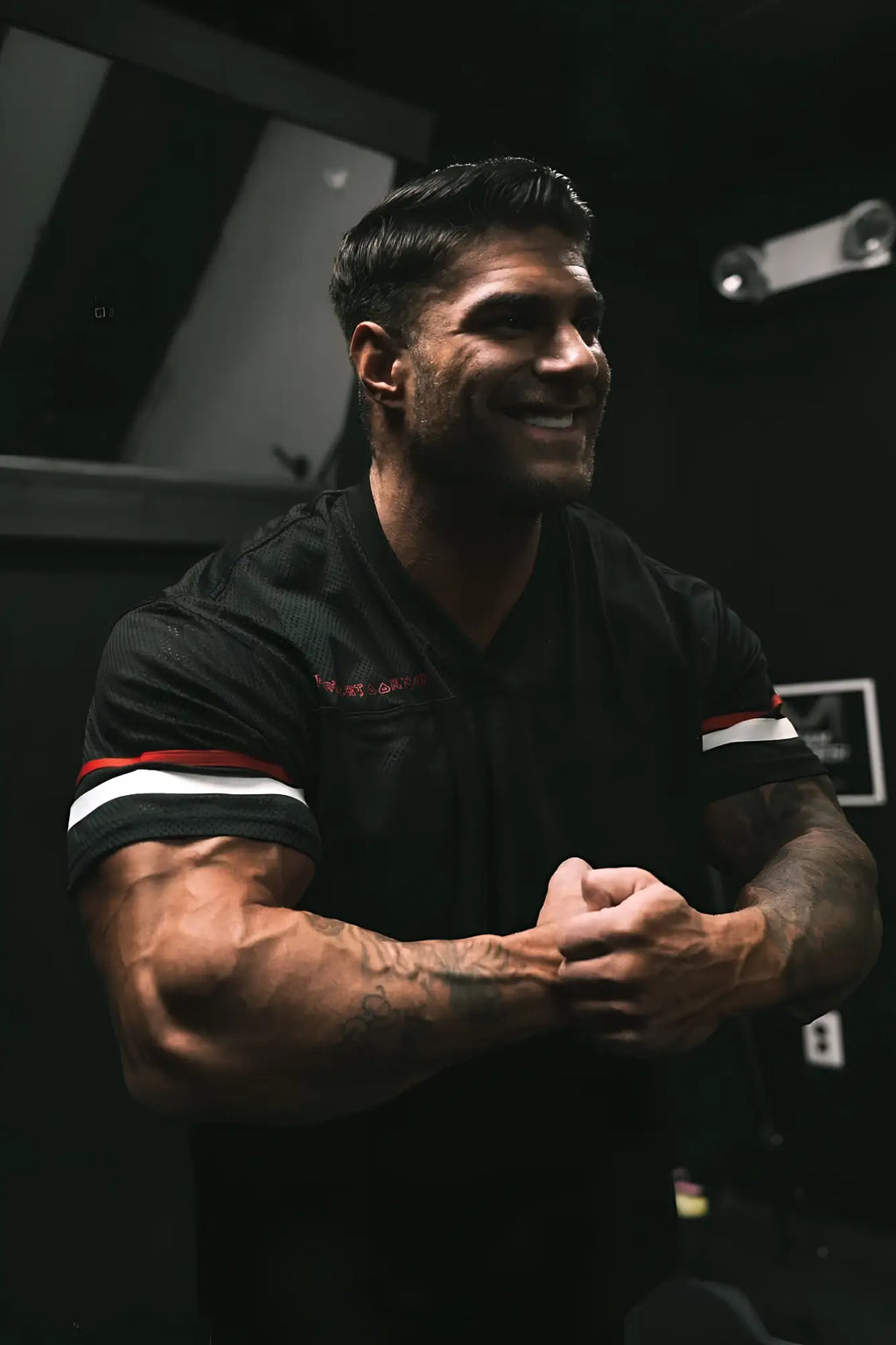 Jed North Warrior V-Neck Jersey black short-sleeved athletic shirt with red and white striped cuffs for training