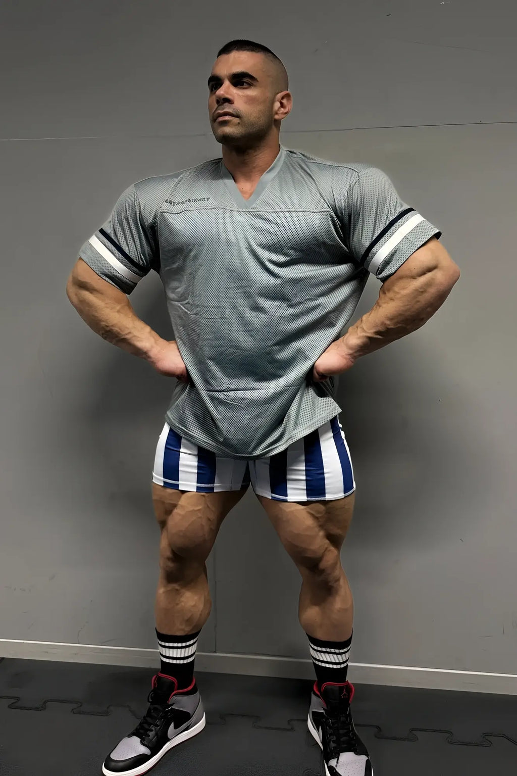 Gray jed north warrior v neck jersey with white striped sleeves designed as an athletic performance shirt