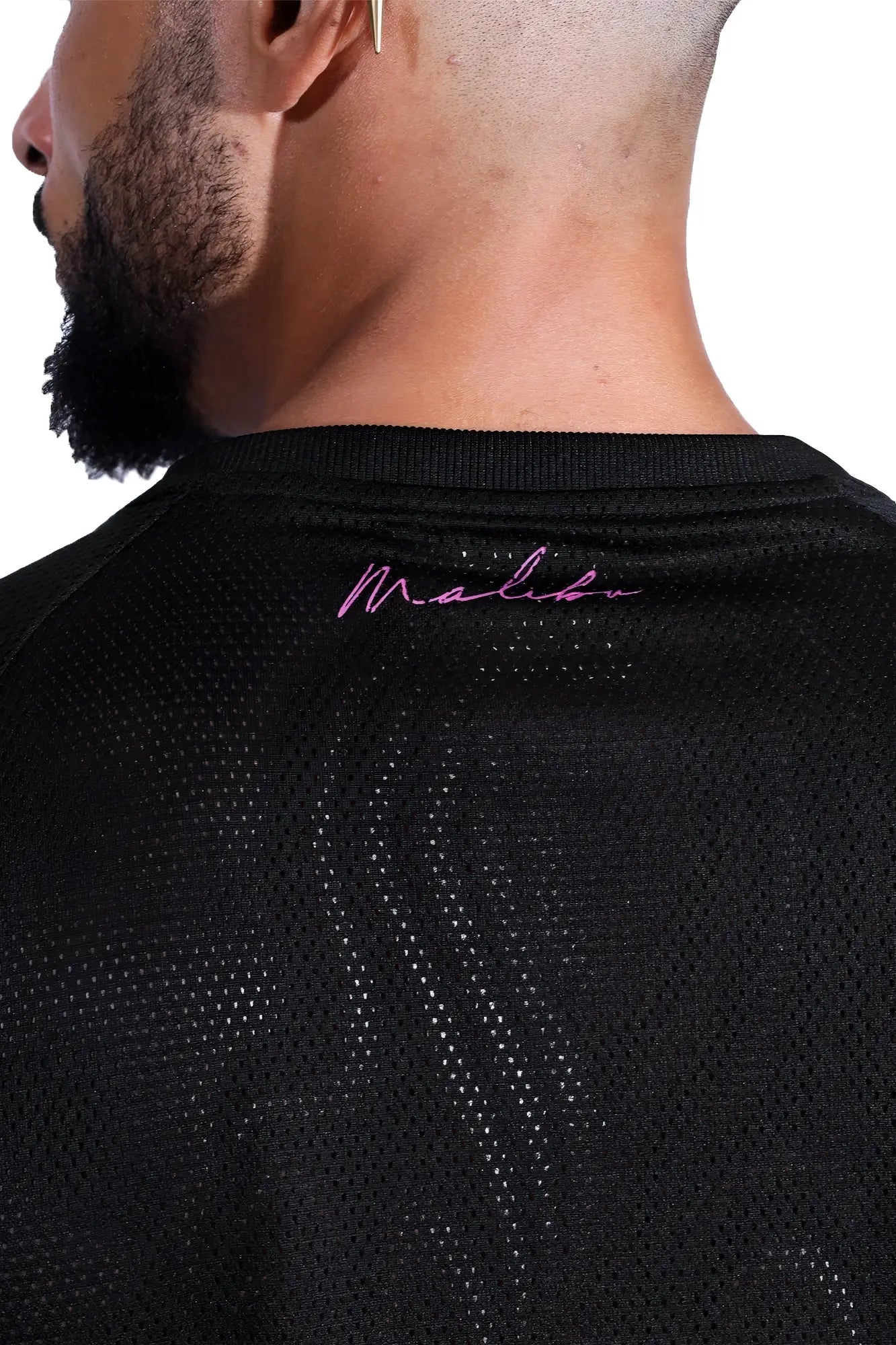 Black mesh cropped t-shirt with pink malibu embroidery at neckline made of breathable jersey mesh material