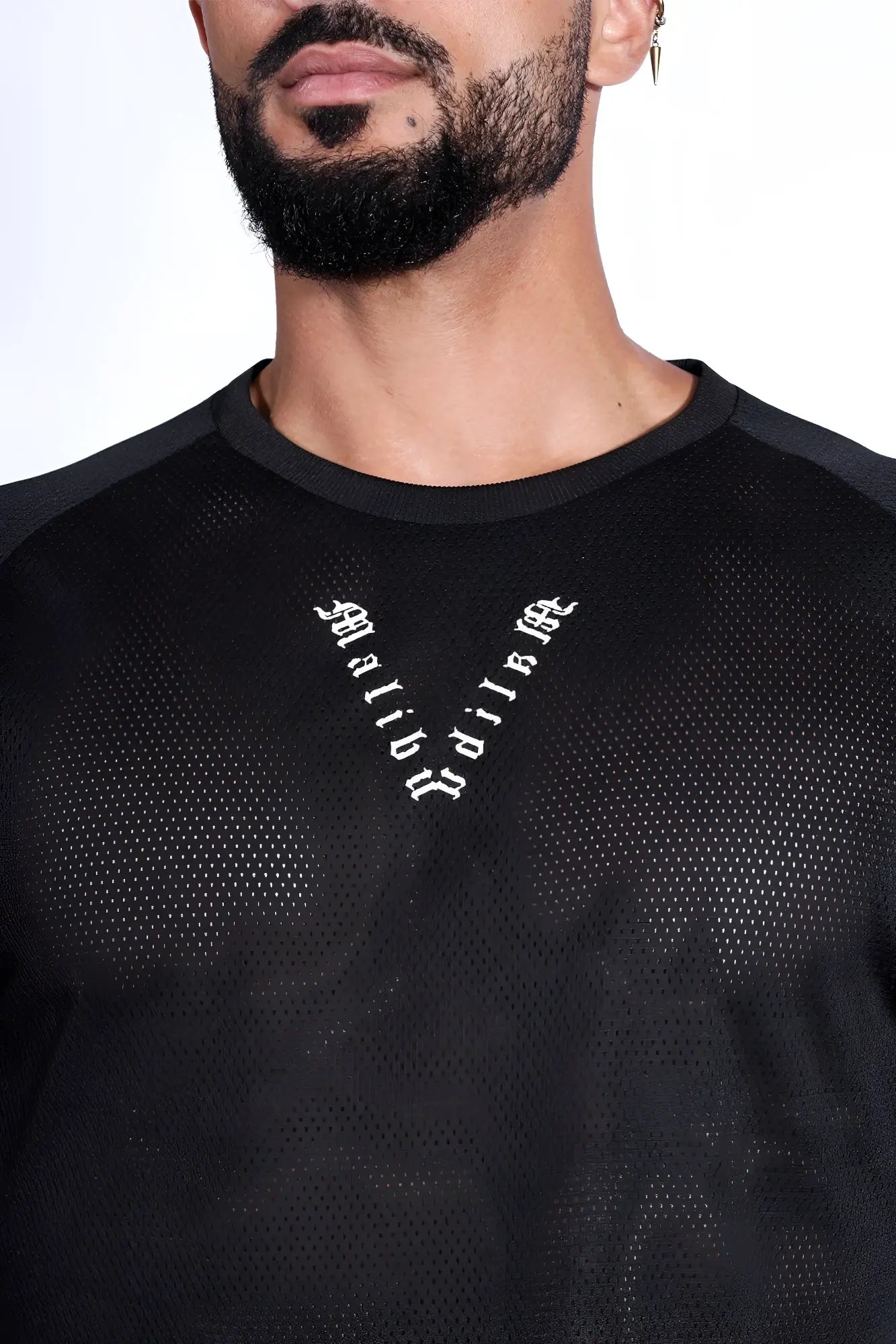 Black mesh athletic cropped t-shirt with raglan sleeves and white gothic lettering in midnight black color