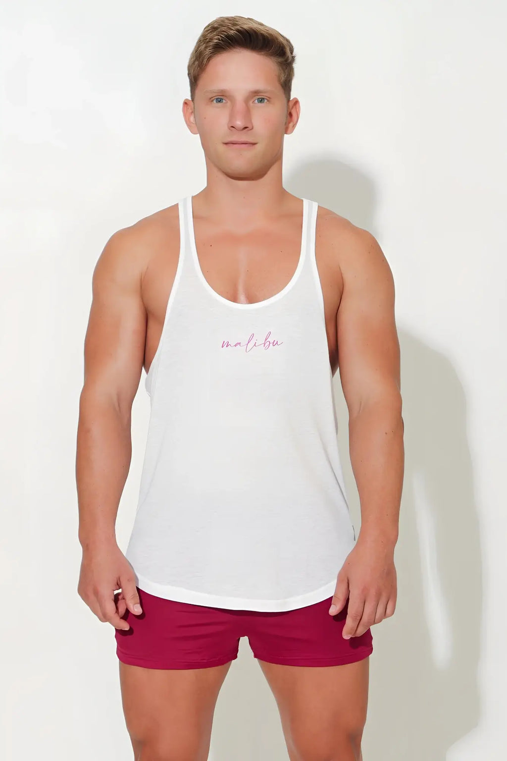 White jj classic workout stringer tank top with subtle pink cursive logo across the chest