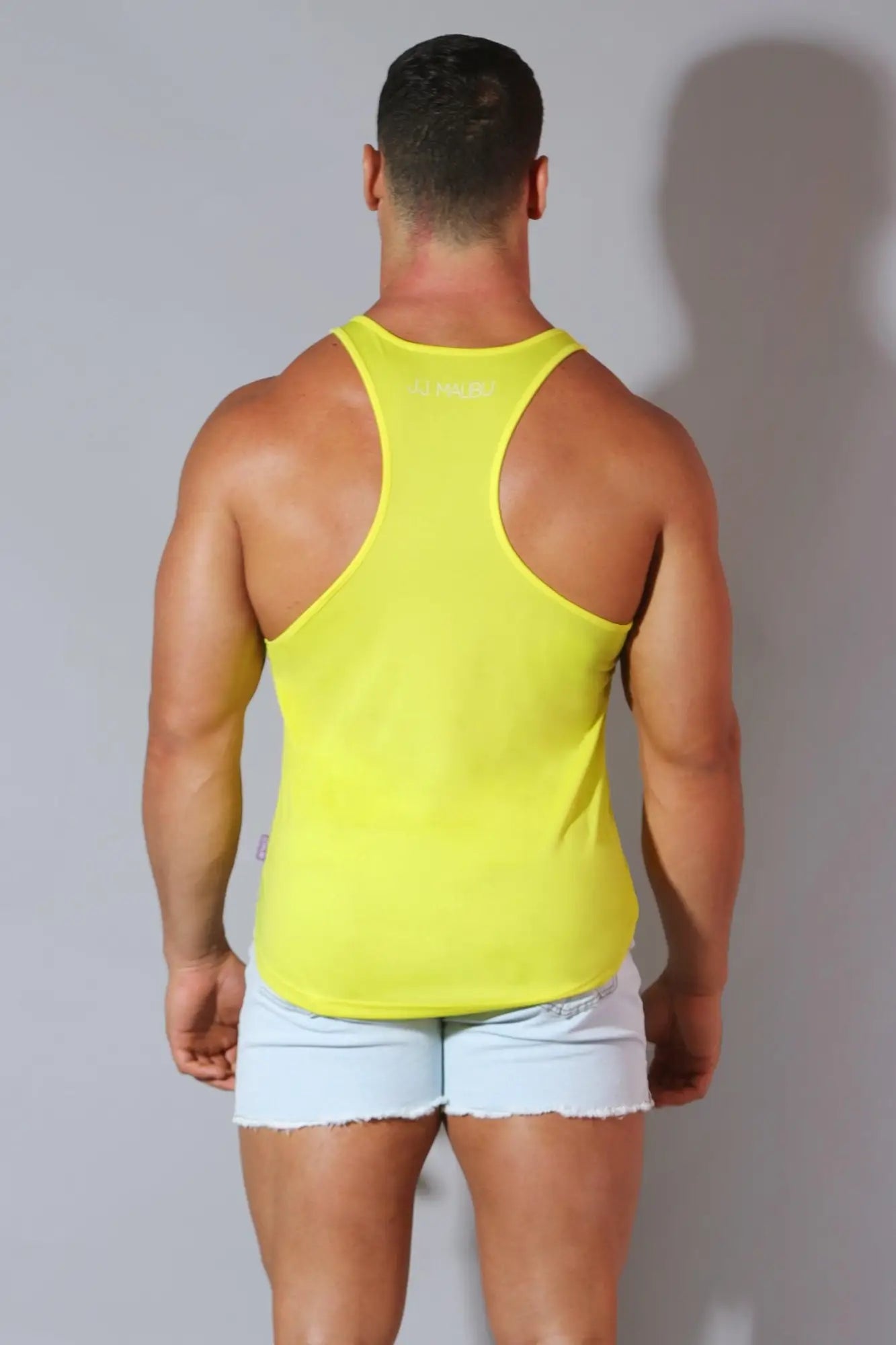 Bright yellow lemon yellow jj cool-dry gym stringer racerback tank top with form-fitting and moisture-wicking fabric