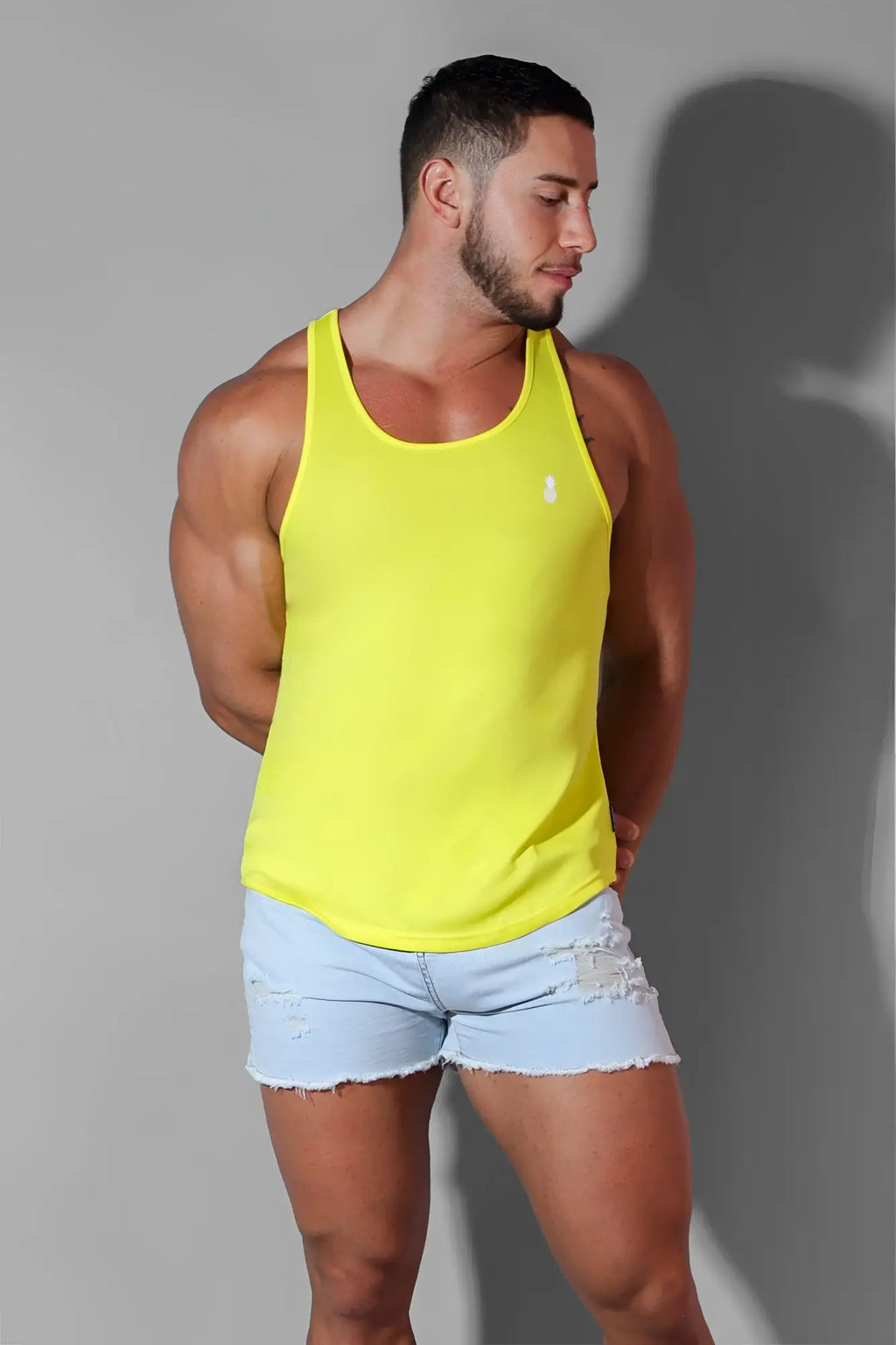 Bright yellow sleeveless jj cool-dry gym stringer tank top with small white chest logo in lemon yellow color