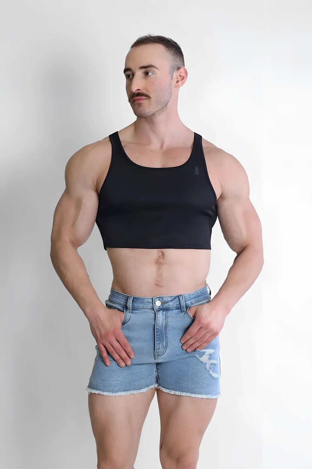 Black jj dry-cool crop tank top featuring a simple fitted design made from breathable moisture-wicking fabric