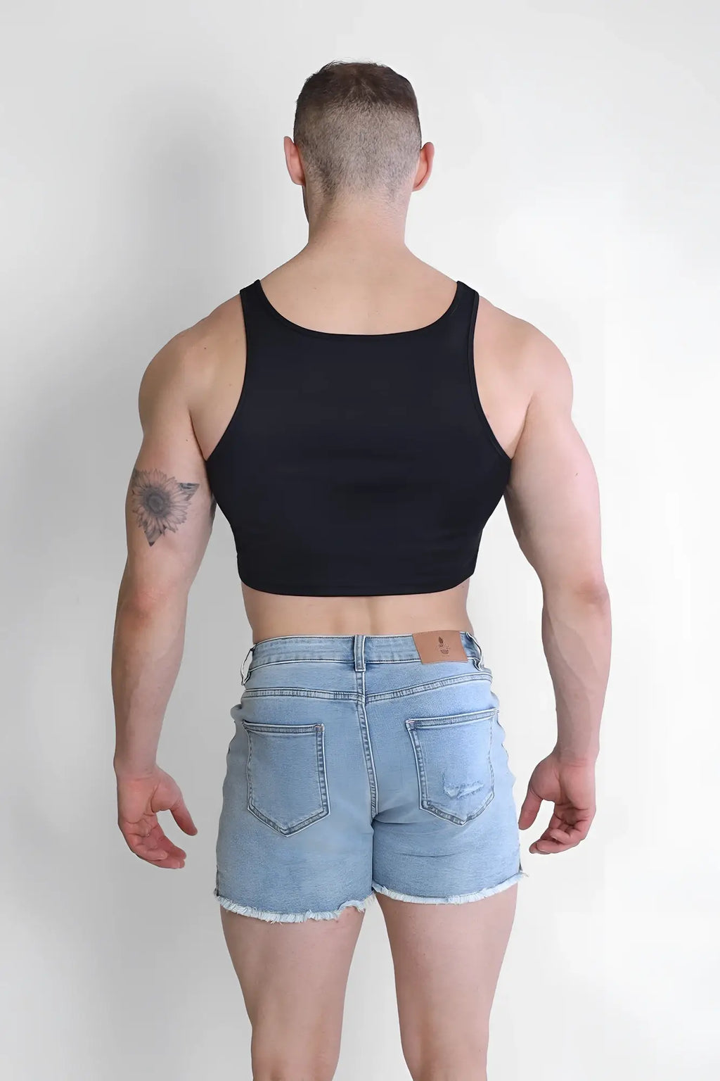 Black jj dry-cool crop tank top with simple fitted design and moisture-wicking fabric for active wear