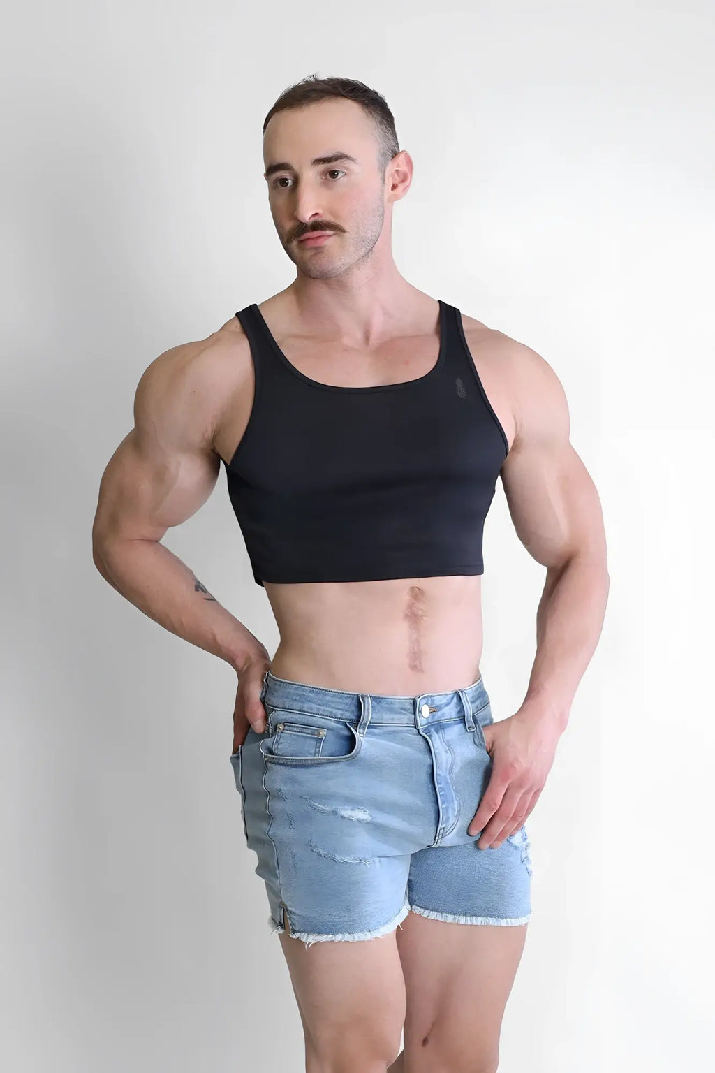 Black jj dry-cool crop tank top with a simple fitted design made from breathable moisture-wicking fabric