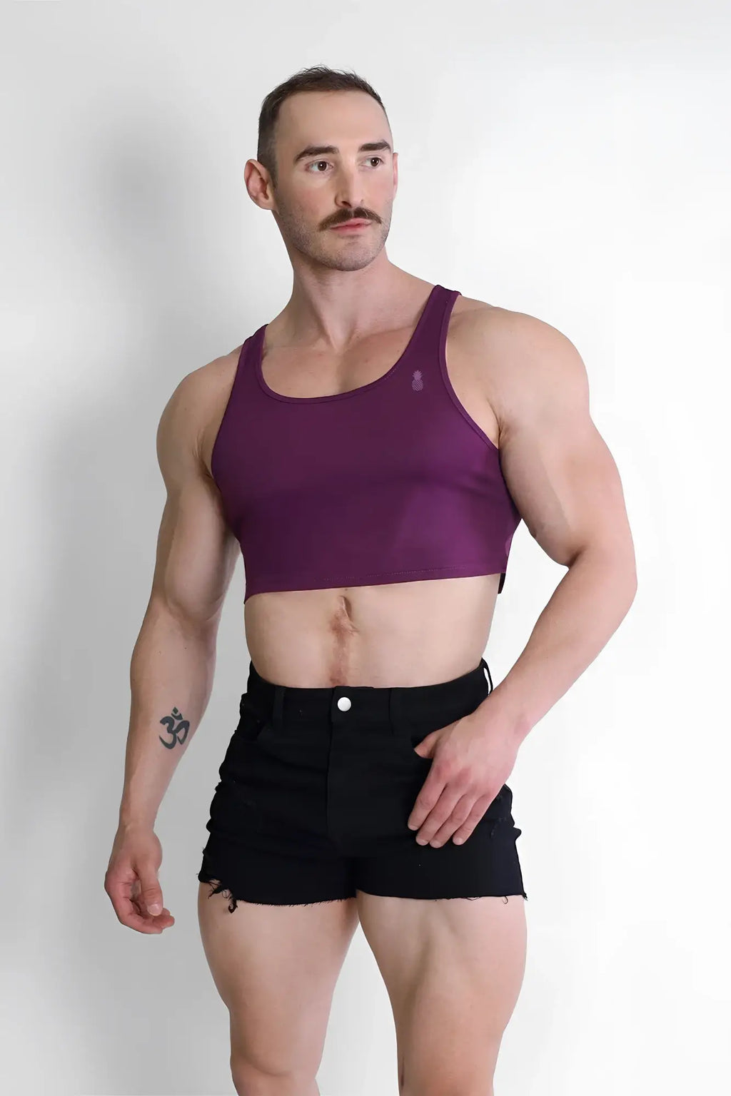 Purple jj dry-cool crop tank top featuring a fitted design with thin straps made for athletic wear