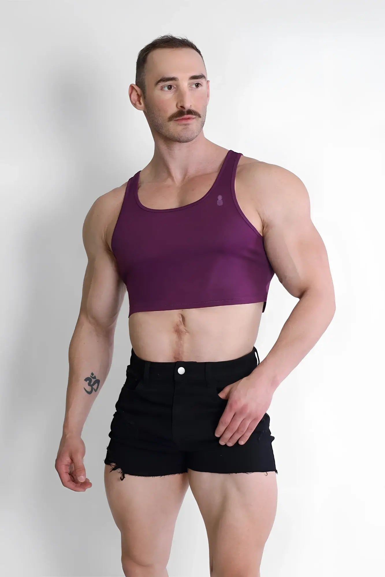 Purple jj dry-cool crop tank top featuring a fitted design with thin straps made for athletic wear