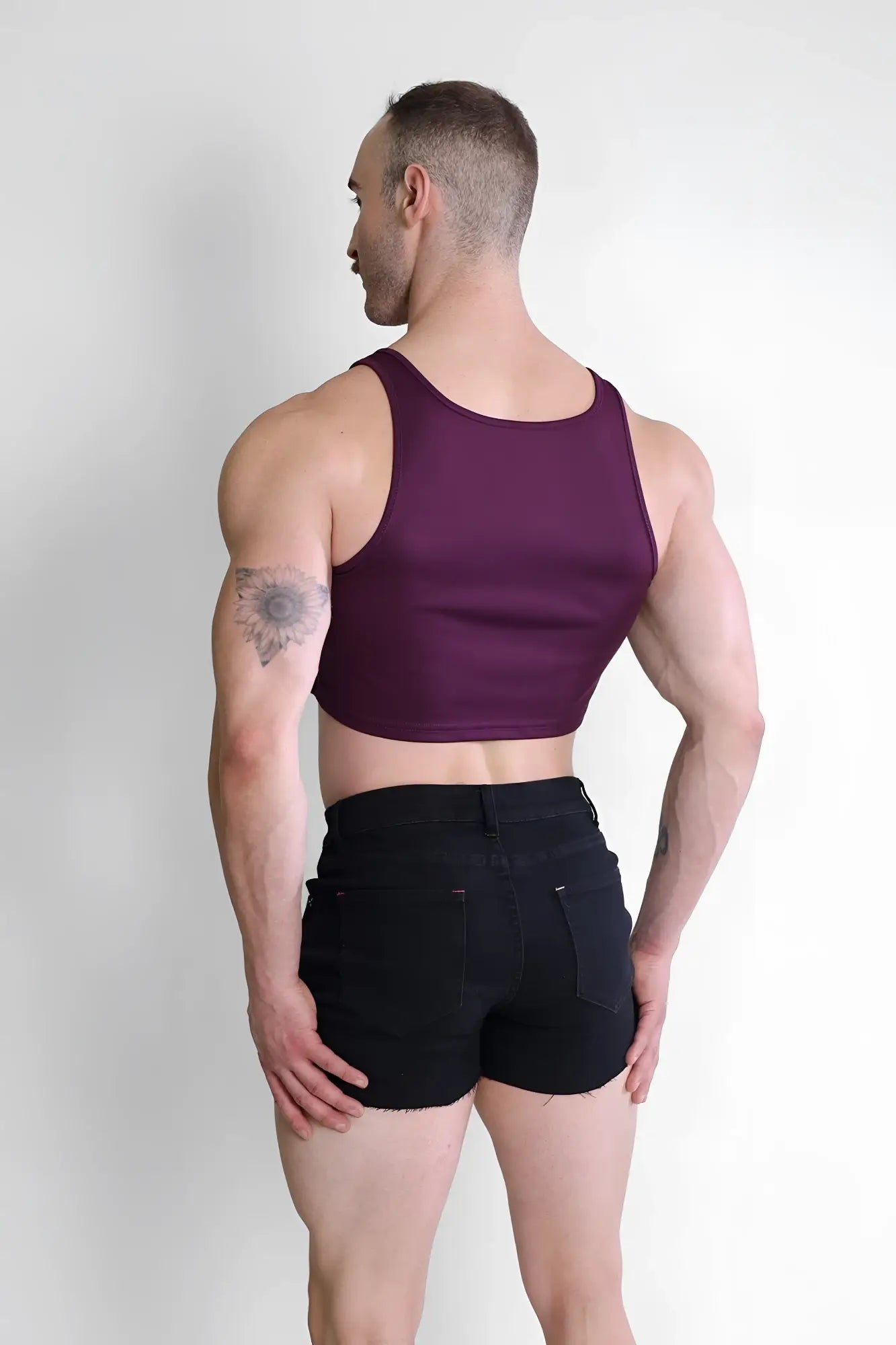 A fitted sleeveless maroon crop tank top with rounded neckline and subtle ribbed texture from JJ Dry-Cool collection
