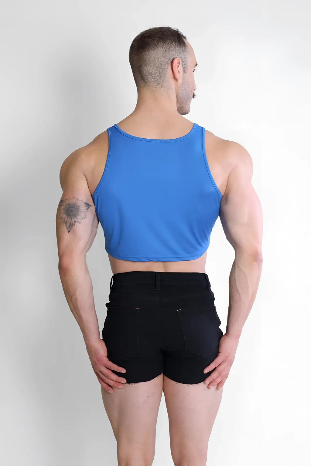 Blue jj dry-cool sleeveless crop tank top made from moisture-wicking fabric for activewear use