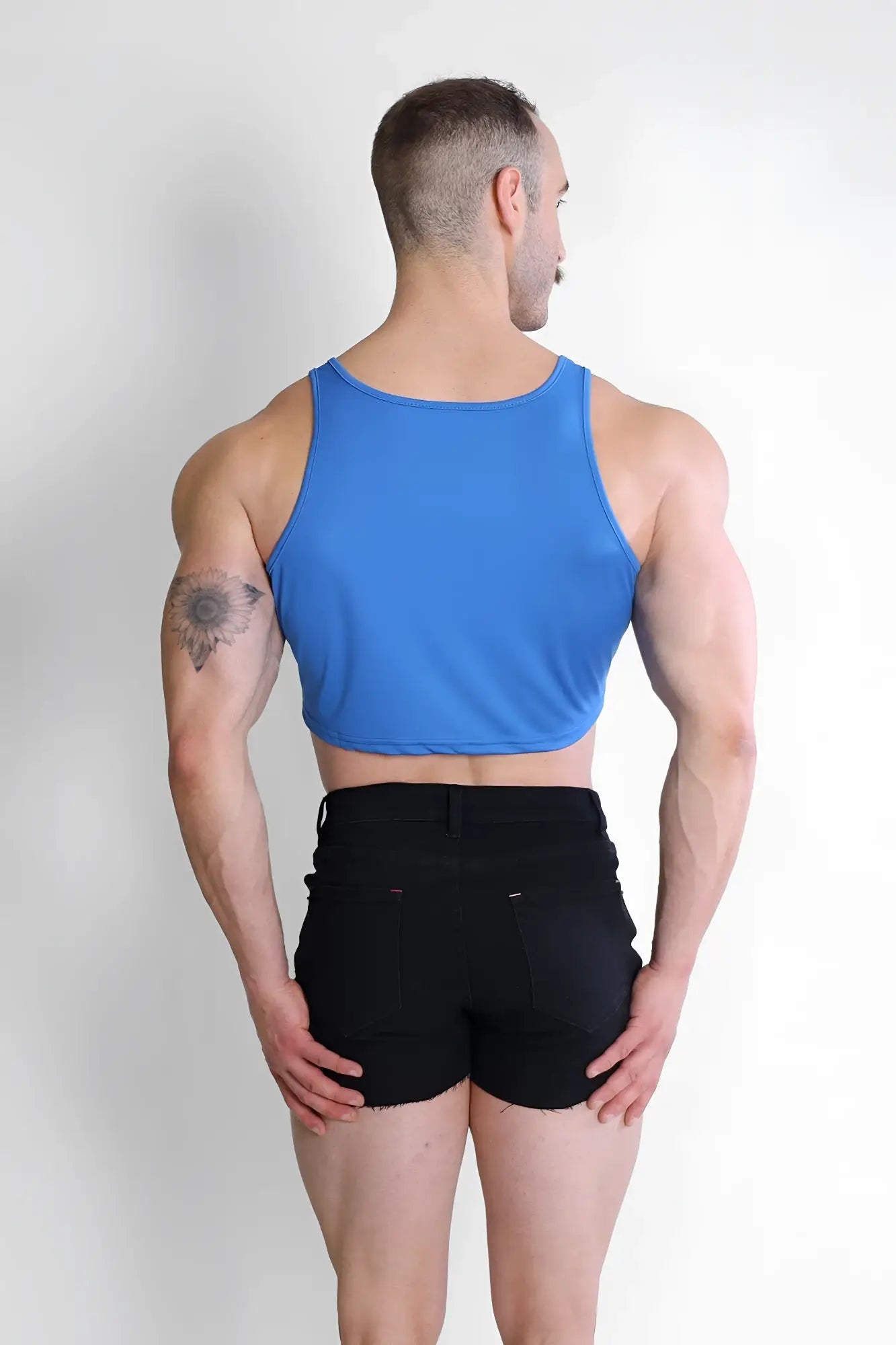 Blue jj dry-cool sleeveless crop tank top made from moisture-wicking fabric for activewear use