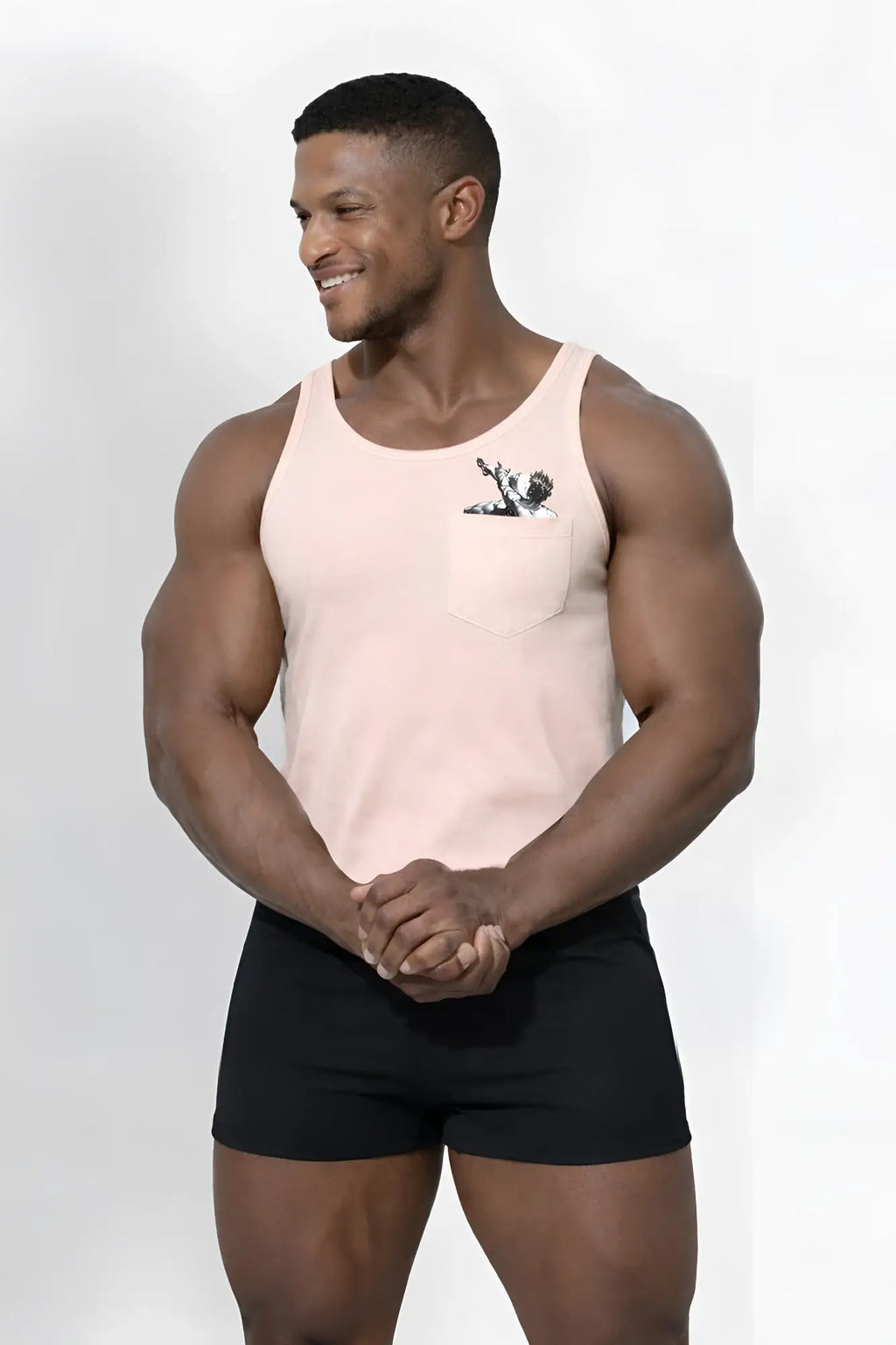 Peach-colored jj pocket tank top with a black and white falling angel graphic on the chest pocket