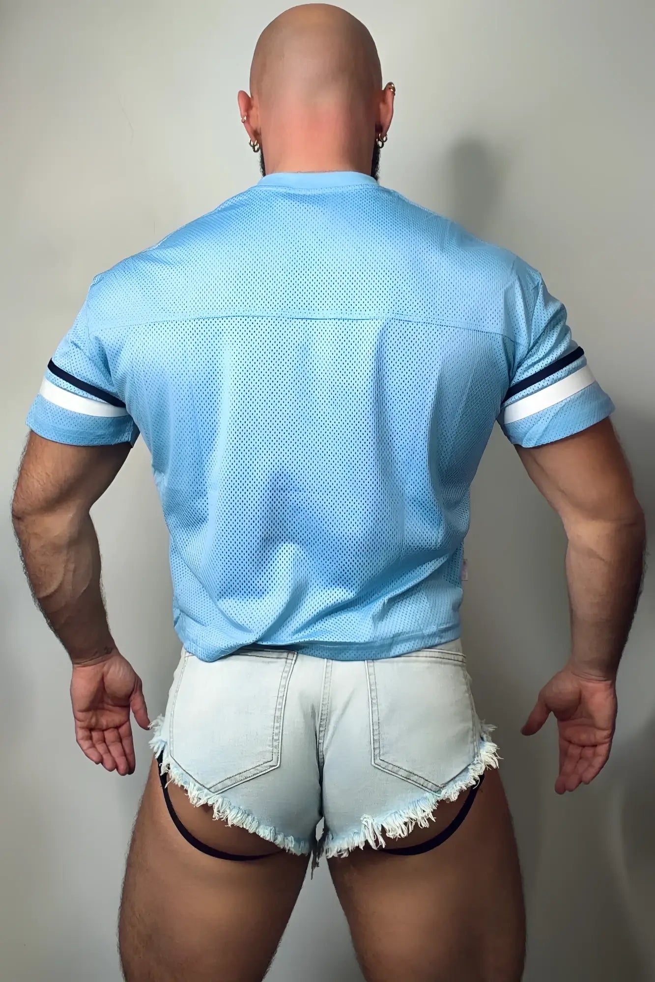 Light blue mesh jj varsity v-neck jersey with white and navy striped sleeves designed for athletic wear