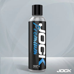 8oz clear bottle of JOCK Premium water-based lubricant with a black label, white branding, and blue accents.