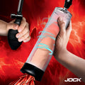 Jock Amp Up Penis Pump with clear cylinder, black base and manual black hand pump bulb against a red fiery background.