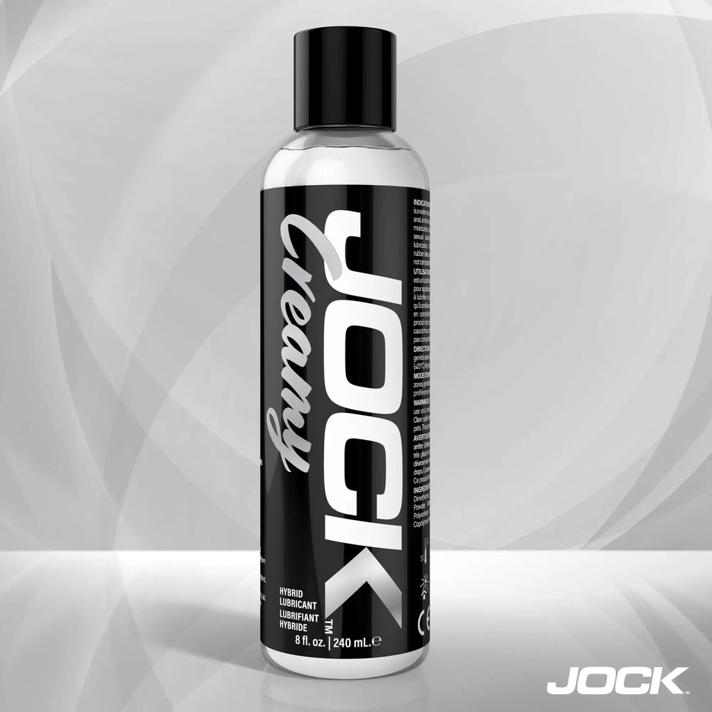 8oz bottle of JOCK Creamy Lubricant with a bold black and white label featuring vertical typography.